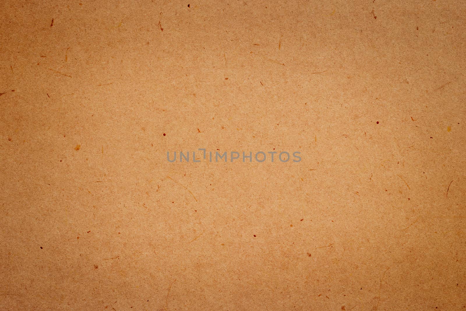 Sheet of brown paper or cardboard texture for background.