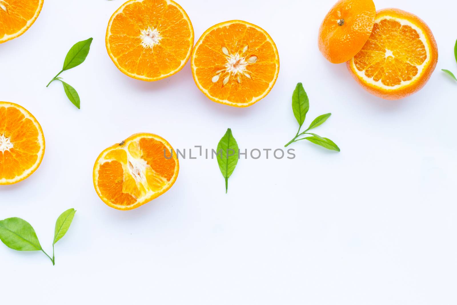 Fresh orange citrus fruit with leaves isolated on white background. 