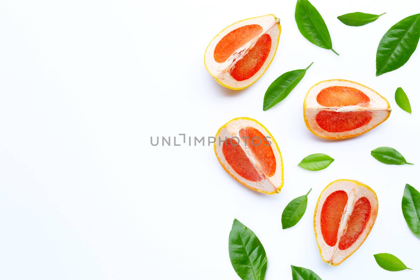High vitamin C. Juicy grapefruit slices on white background.