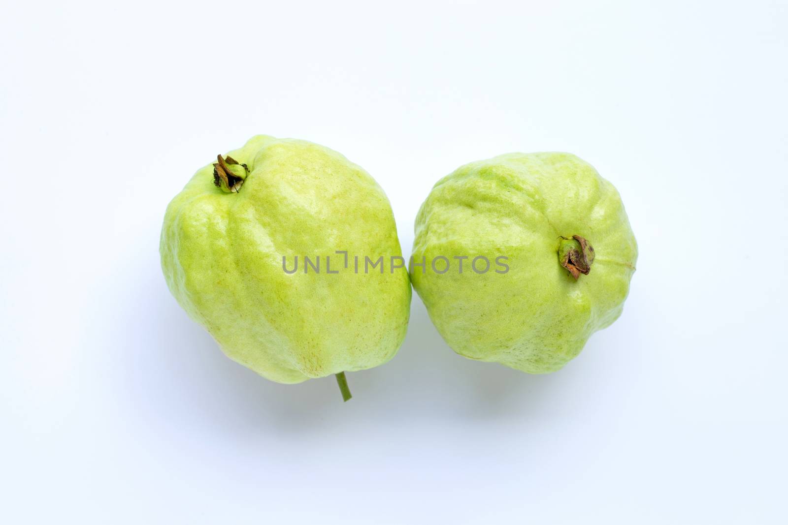 Ripe guava on white background. Copy space