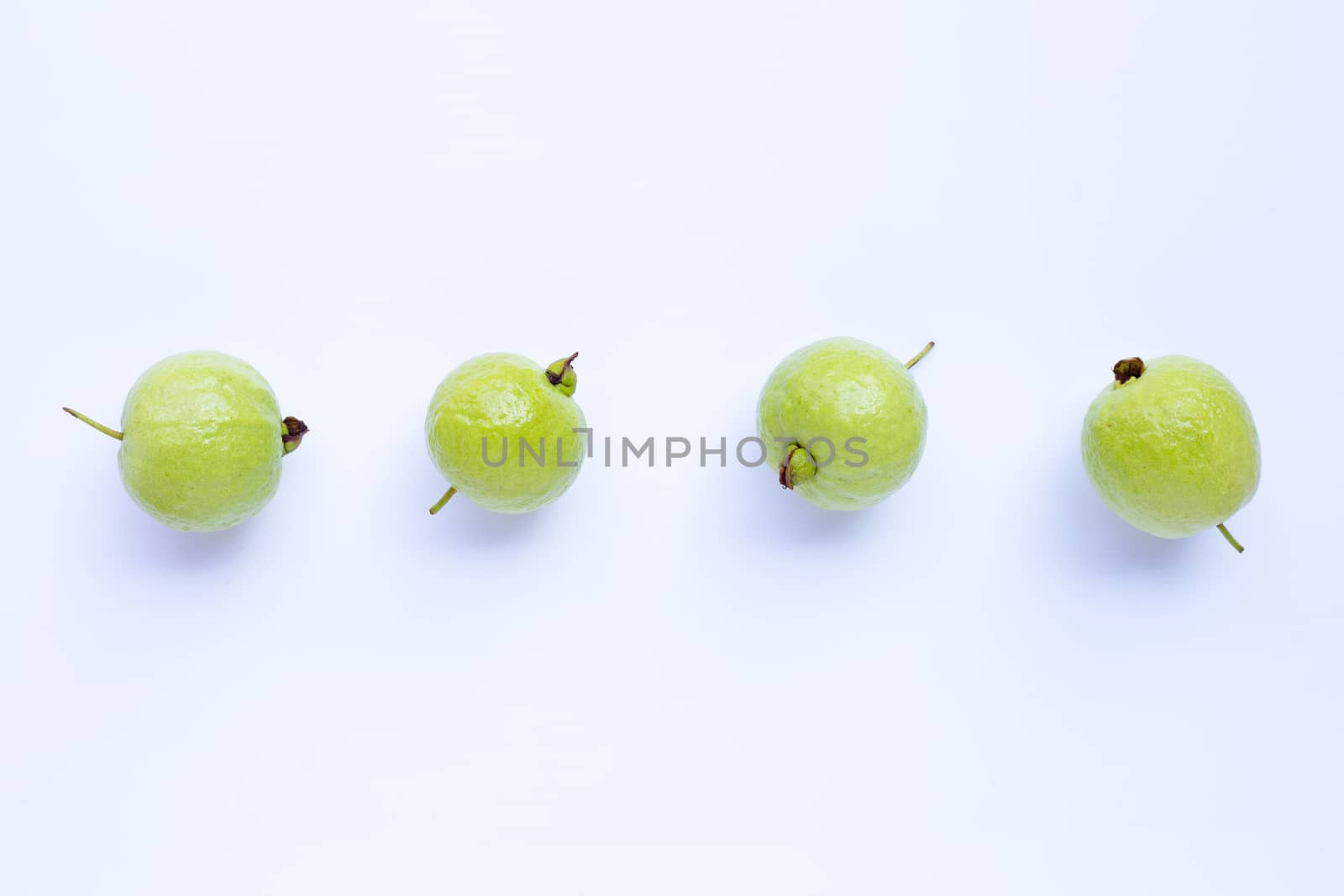 Fresh ripe guava on white. Top view