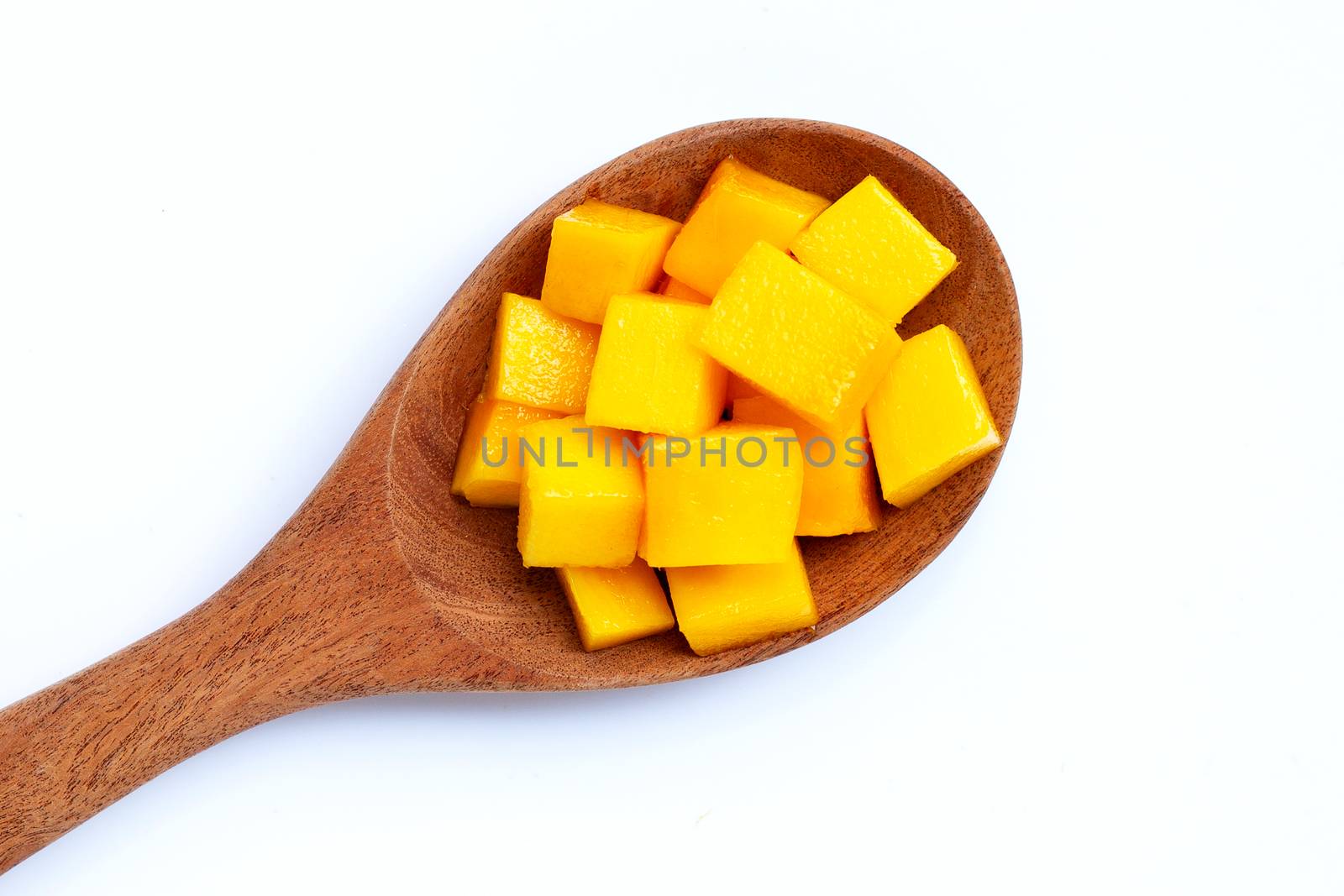 Tropical fruit, Mango cube slices on wooden spoon on white background. 