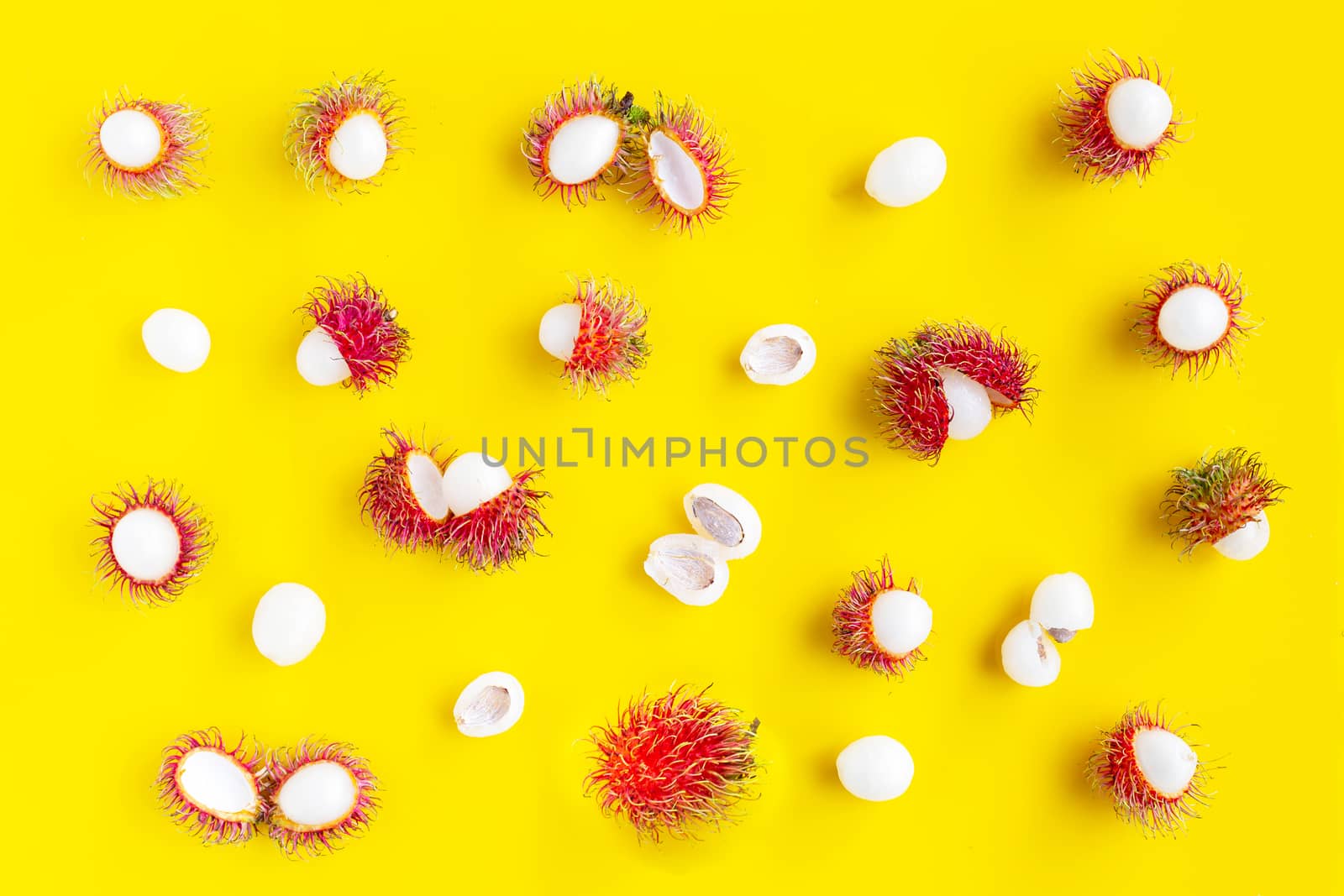 Top view of Rambutan  on yellow background. Copy space