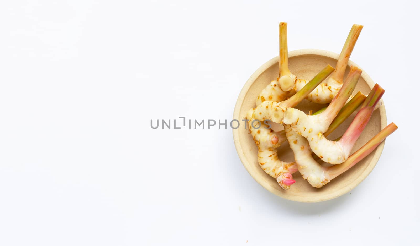 Fresh galangal isolated on white background.