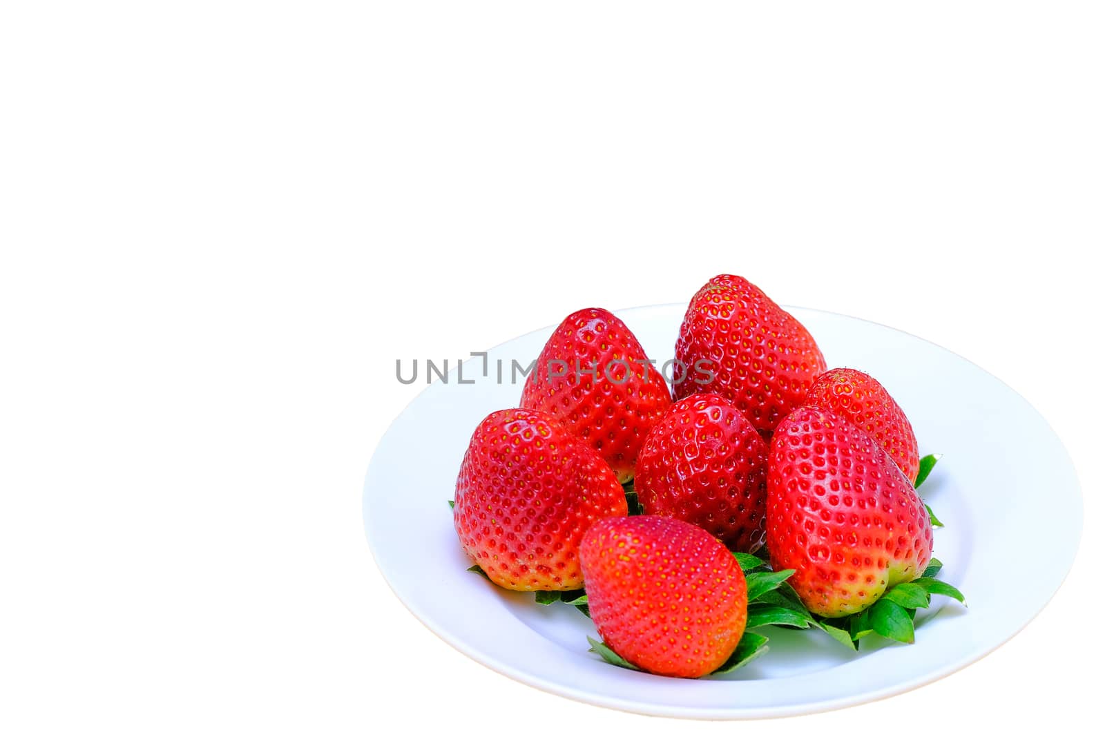 a bunch of large strawberries on a white plate, isolated on white background, copy space