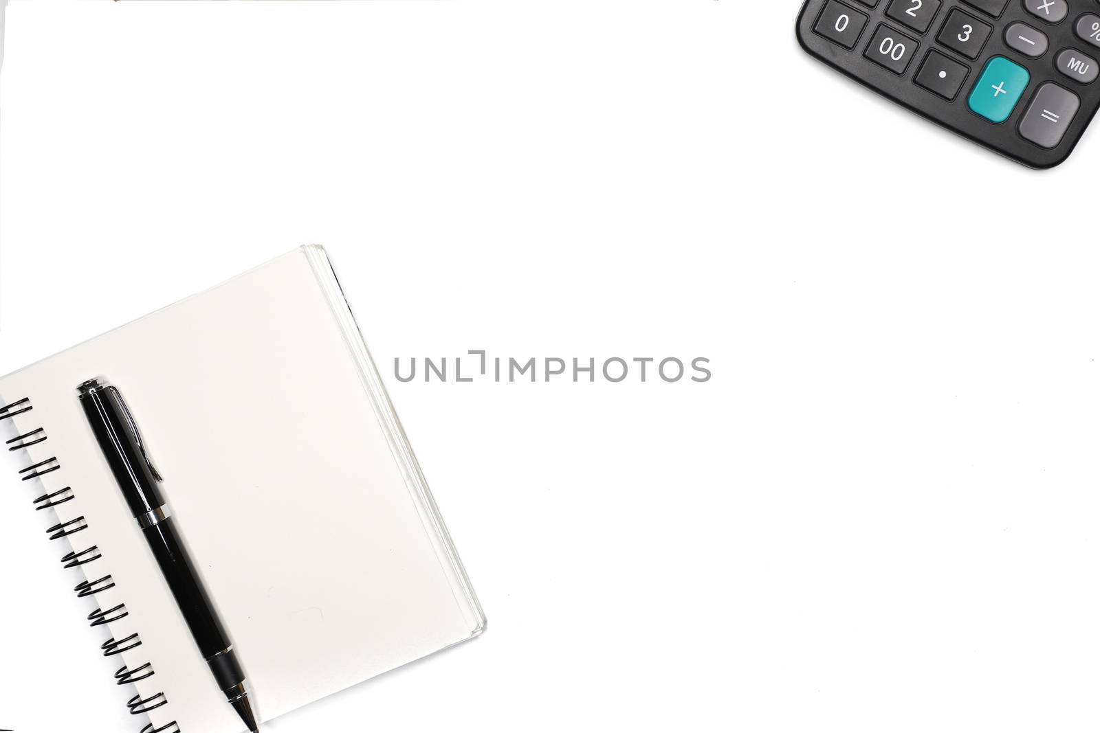 top view of notebook a pen and a calculator, minimal office, isolated on white background