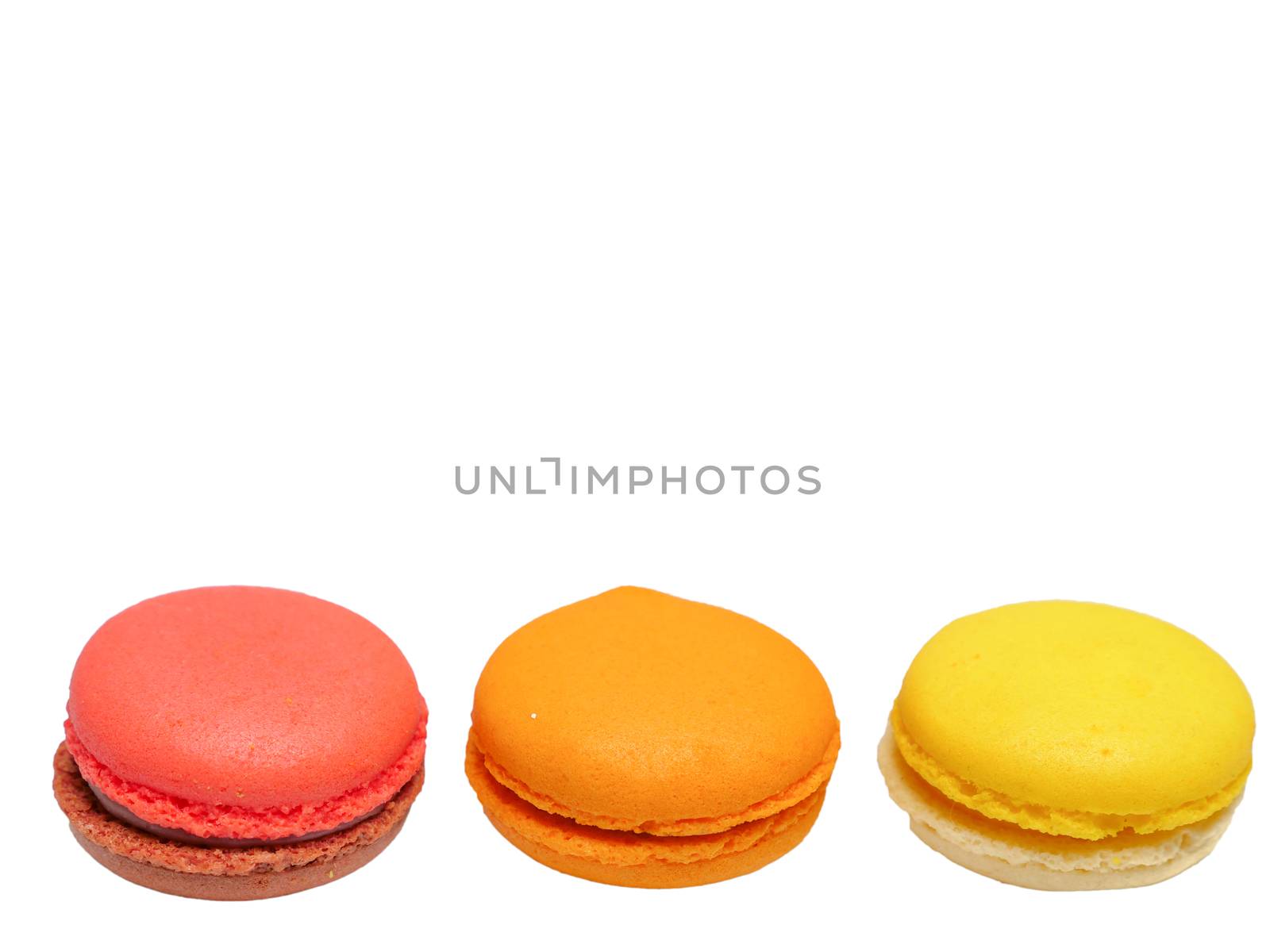 raspberry, orange, and lemon flavoured macaroons with chocolate and jam filling, macro top view clean minimal style, isolated on white background