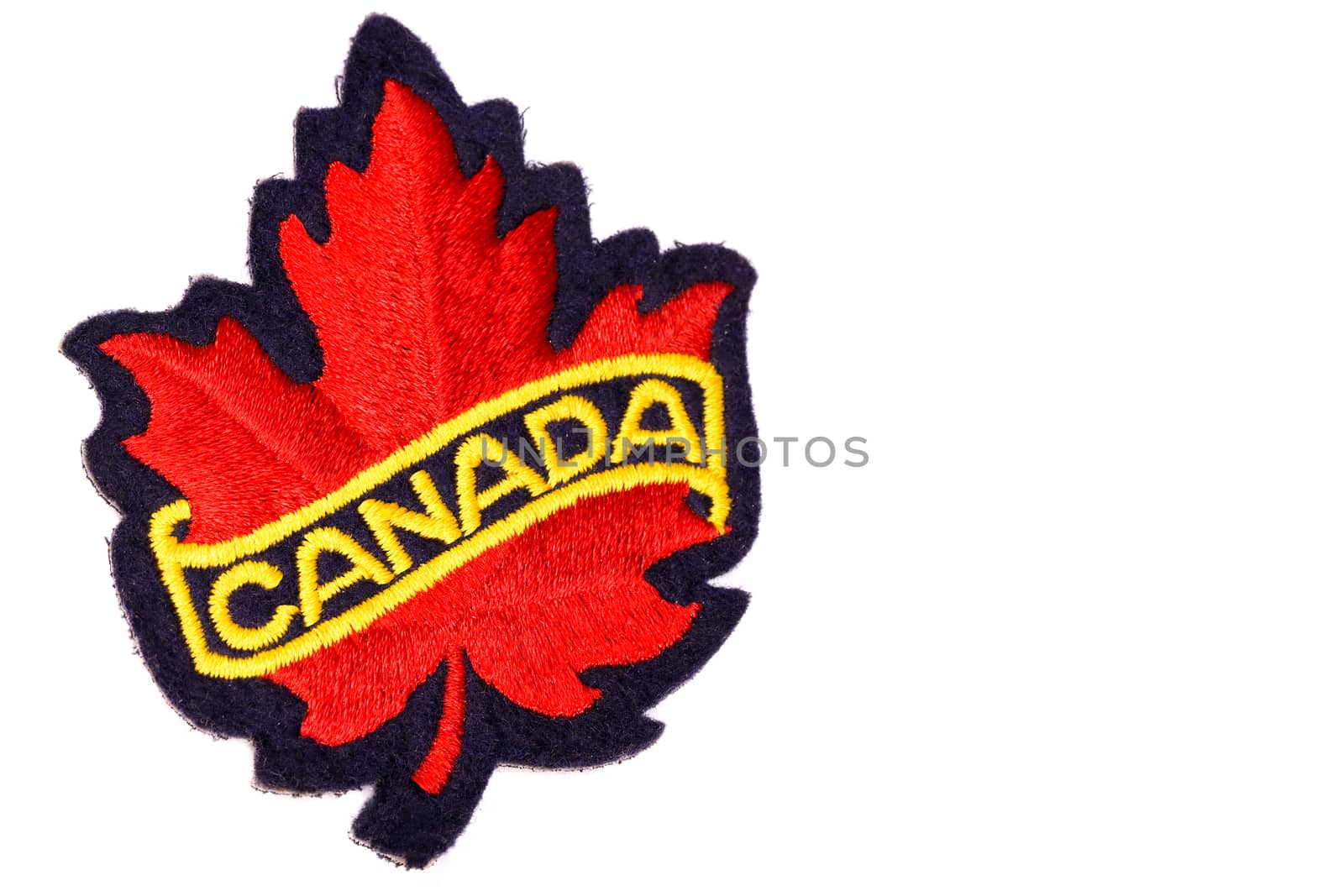 canada red maple leaf emblem made of embroidery cloth, isolated on white background