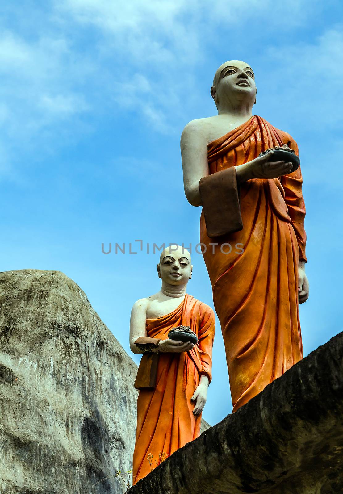 Buddhist Monks walk rock Golden Temple Dambulla Sri Lanka by Vladyslav
