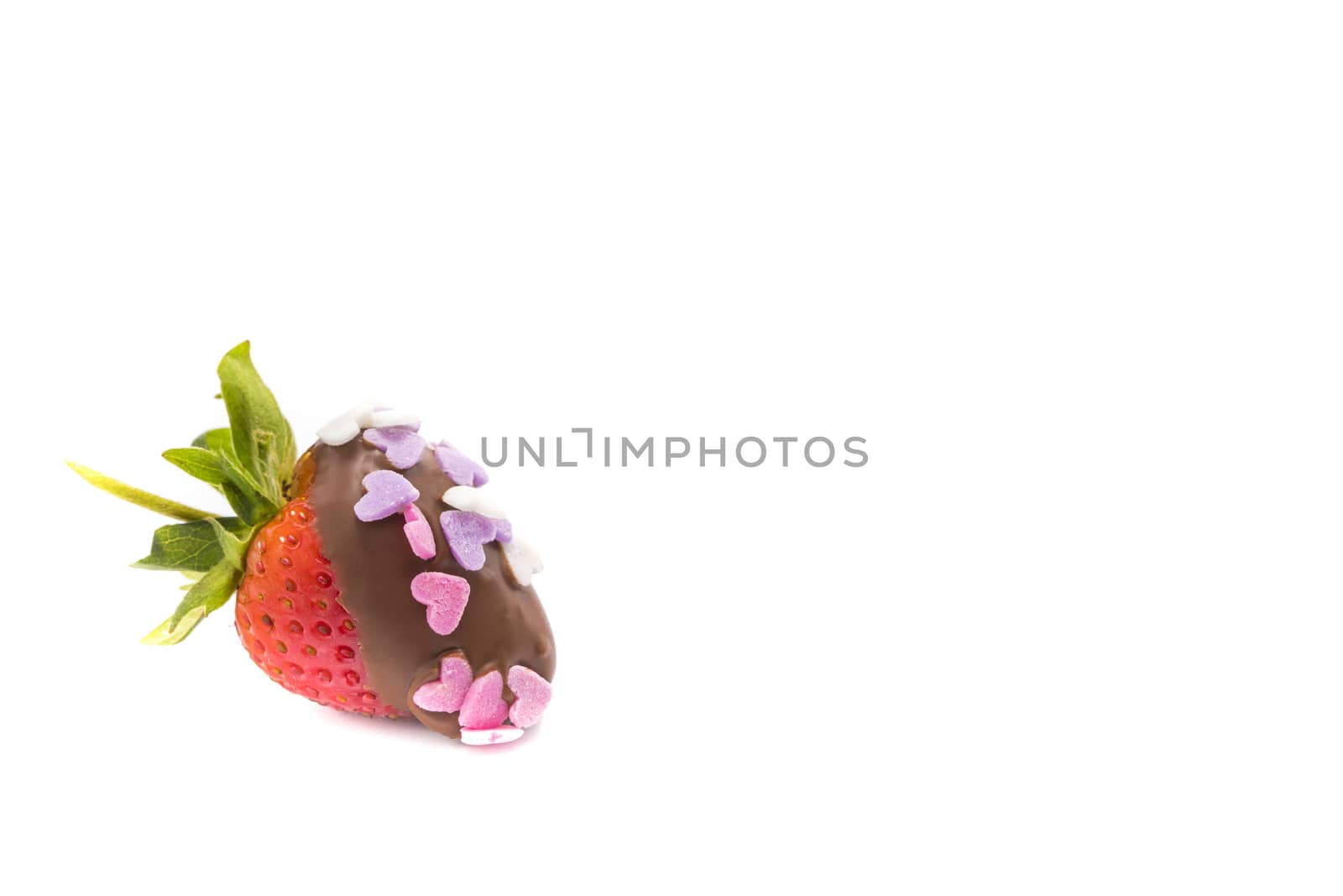 a chocolate coated strawberry with small heart-shape sugar confetti, isolated on white background, Valentine