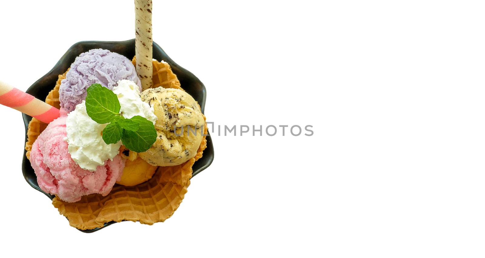 three scoops of ice cream in a waffle, top view, isolated in white background