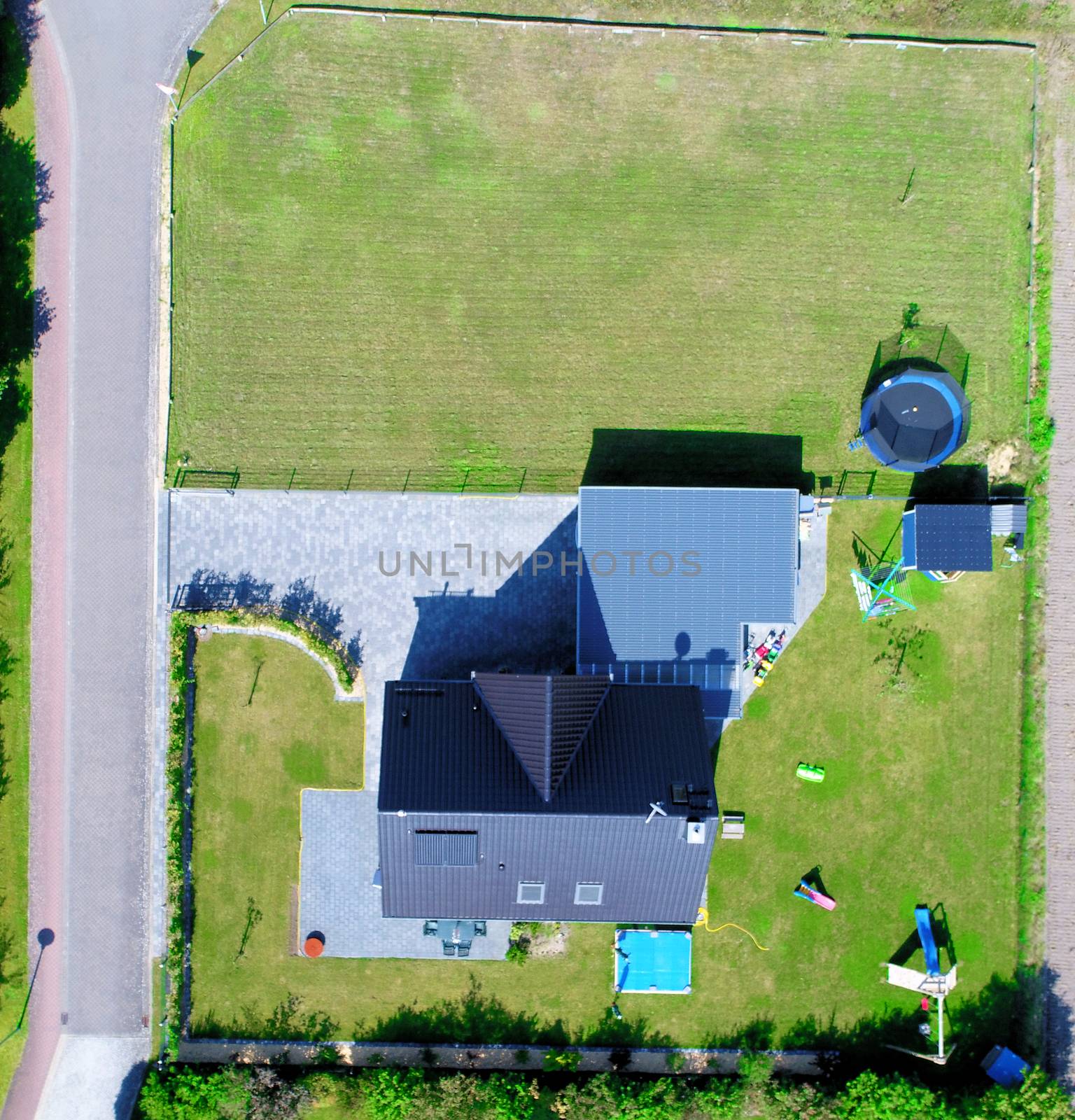 Aerial photo with the drone, anew build-up plot with single houses and gardens, narrow neighborhood