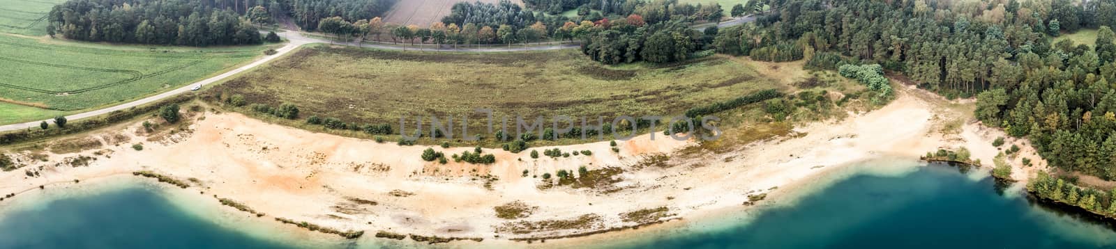 Aerial photograph with drone, panorama, beach at a water-filled sand quarry  