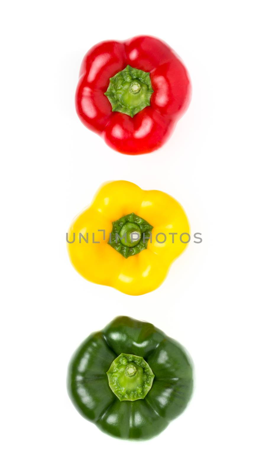 Fresh and delicious stoplight bell peppers isolated on white background. Flat lay.