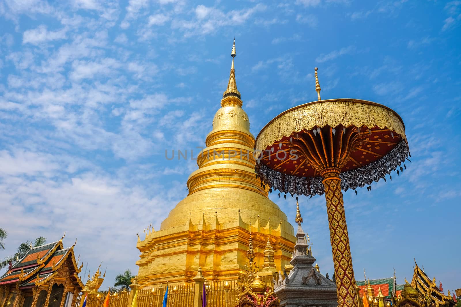 A golden pagoda at Wat Phra That Hariphunchai, the most important buddhist landmark in Lumphun city, Northern Thialand