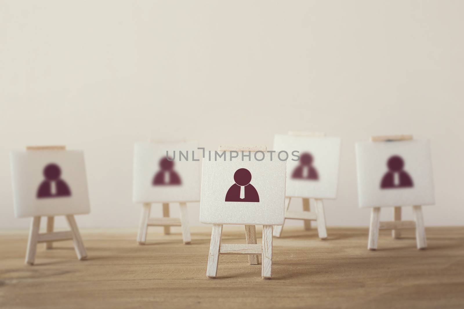 Business Leadership concept : Businessman icon with sign stand. Stand out from the crowd and think different. Select team leader, staff, building a good team, human resources and management.