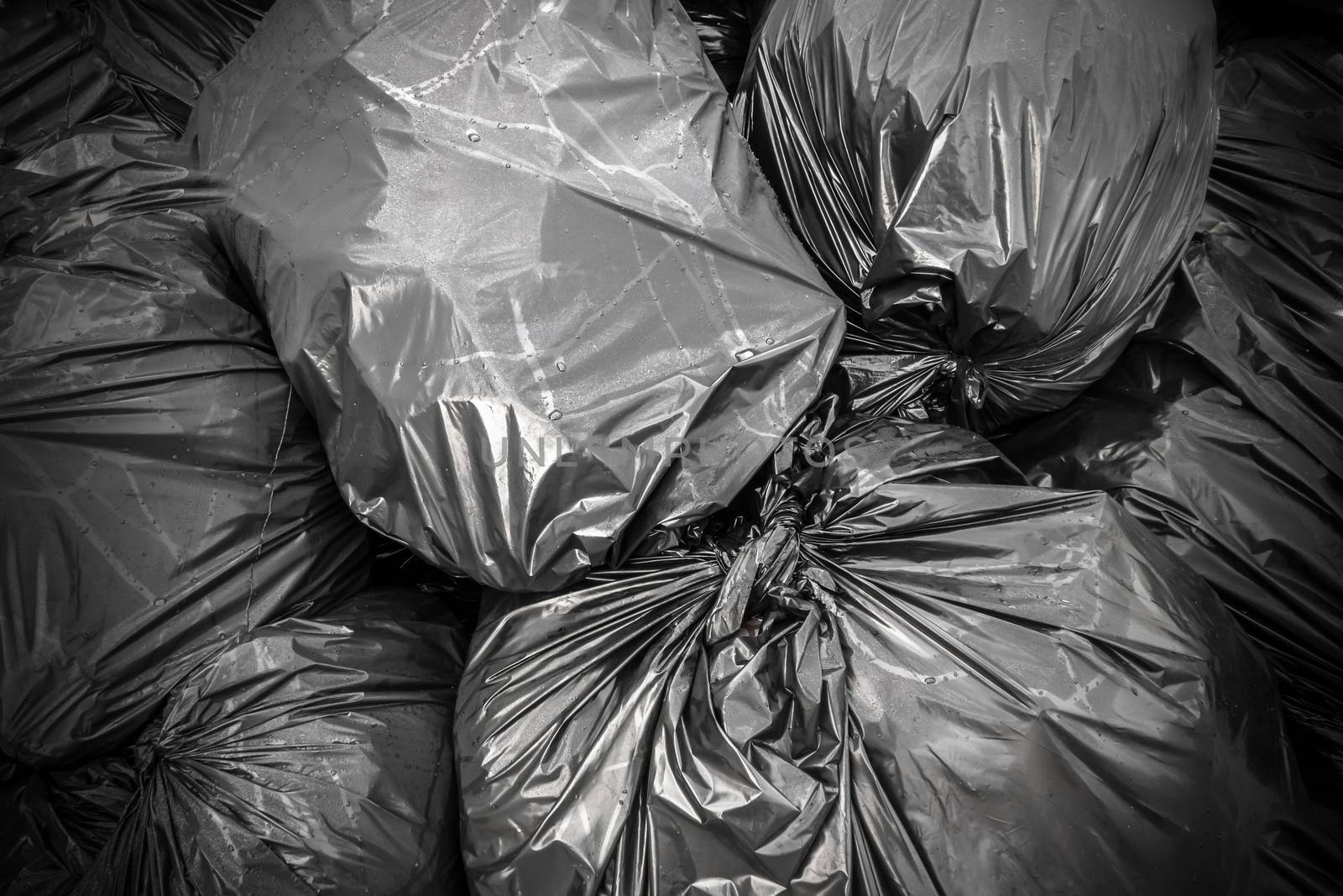 Background garbage bag , black waste, Garbage dump, Garbage, Rubbish, Plastic Bags, stack of junk. Ideal for concepts or texture.