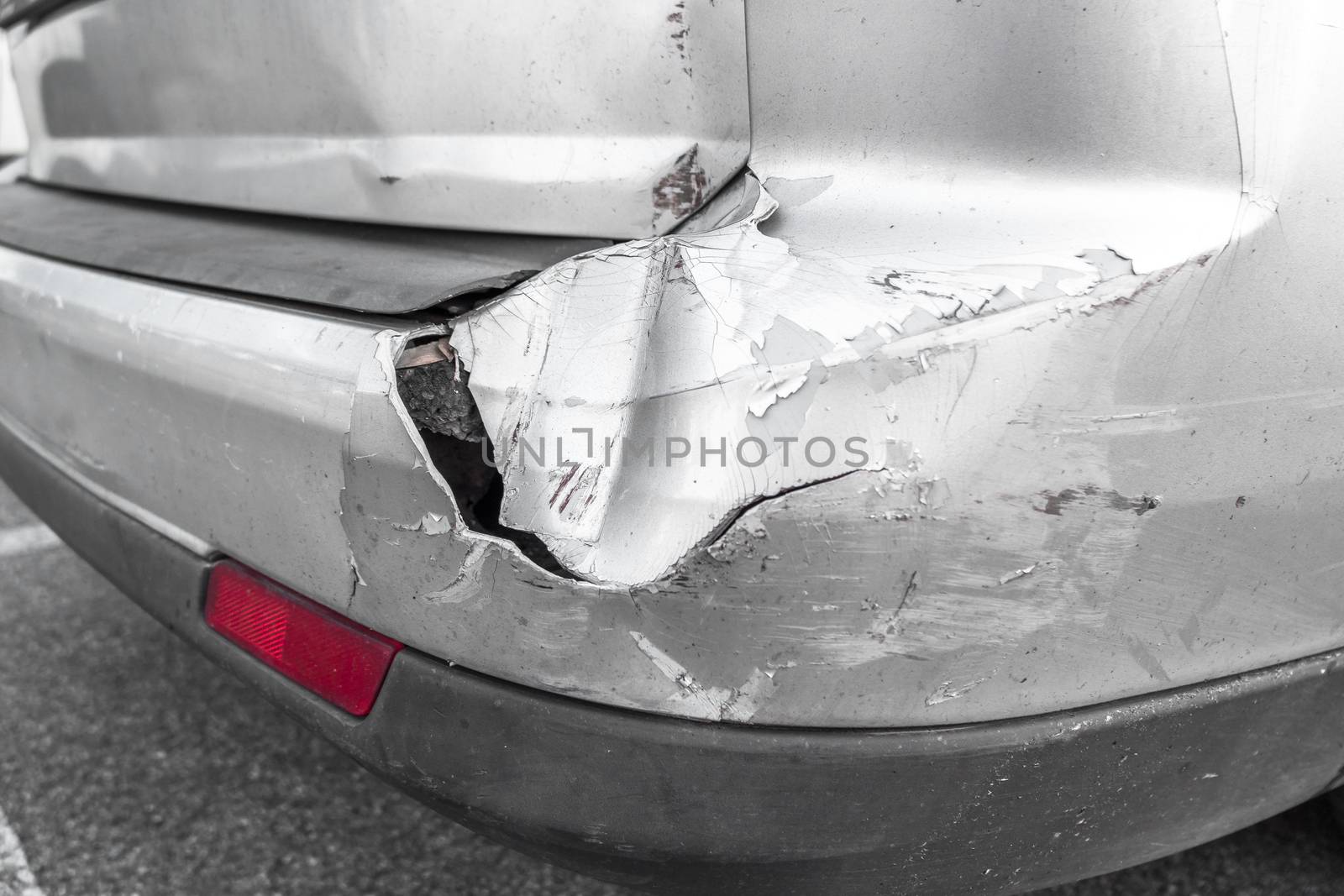 Back of gray car get damaged from accident on the road by germanopoli