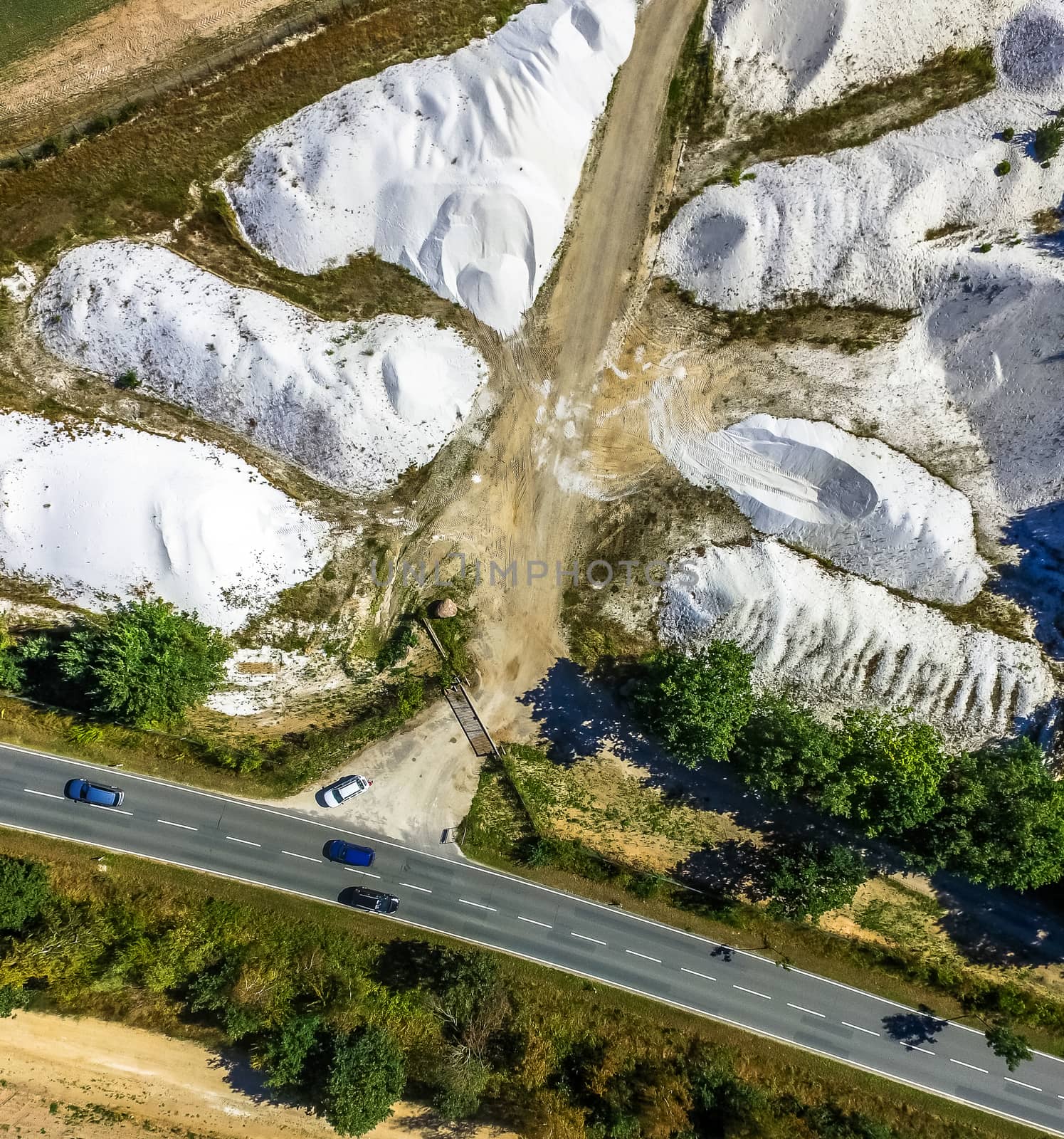 Aerial view of white qauartz at Uhry, Germany. Street in front of the hills 