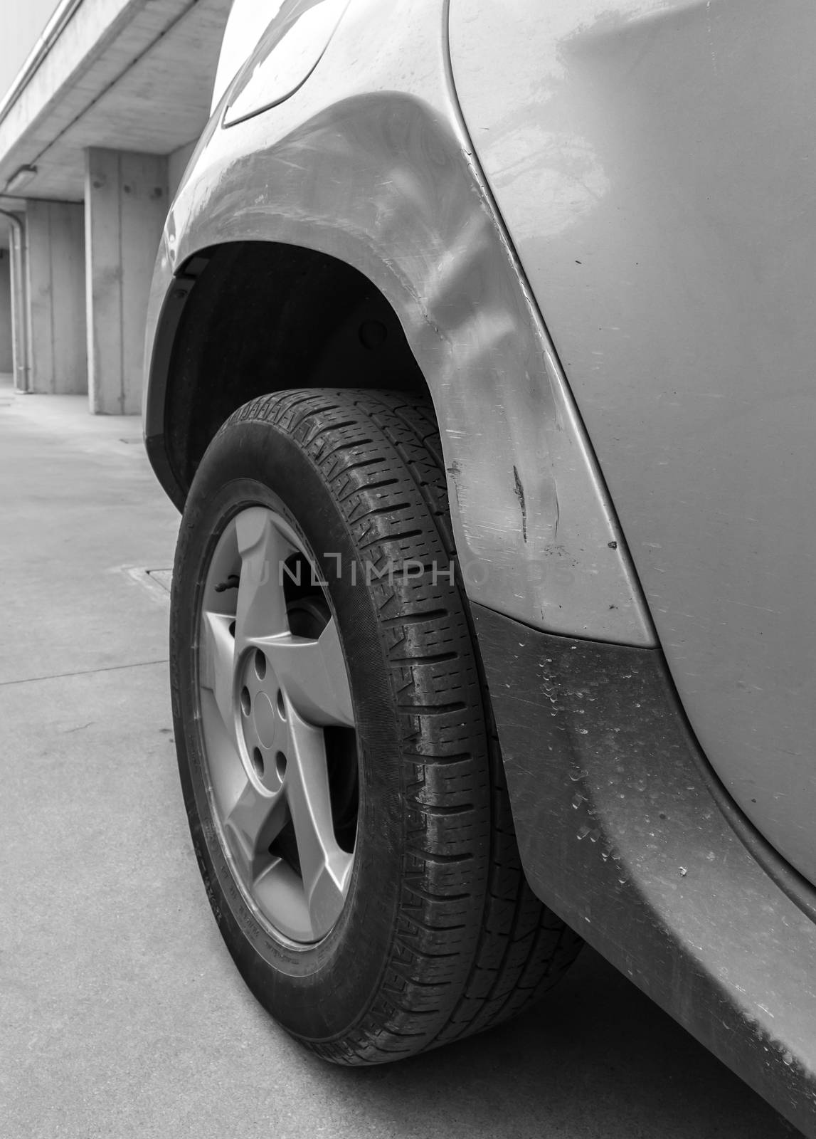 Dents on the car caused by the accident. Close-up.