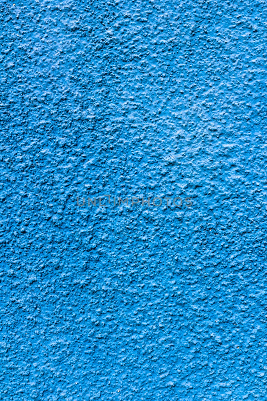 Abstract deep blue wall plastered texture. Rustic background.