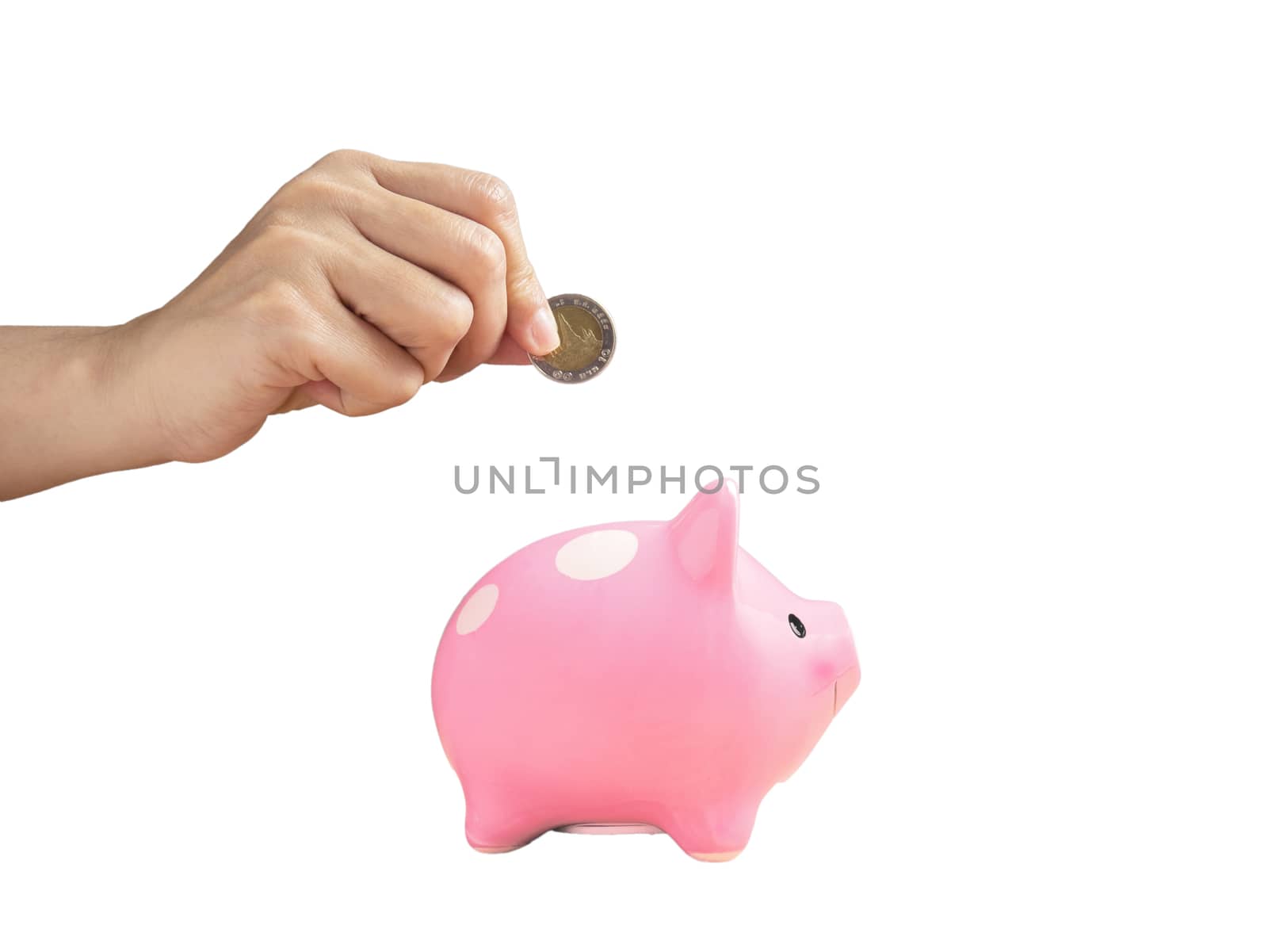 woman putting coin into piggy bank isolated on white background with clipping path. finance and saving money for future concept. by asiandelight