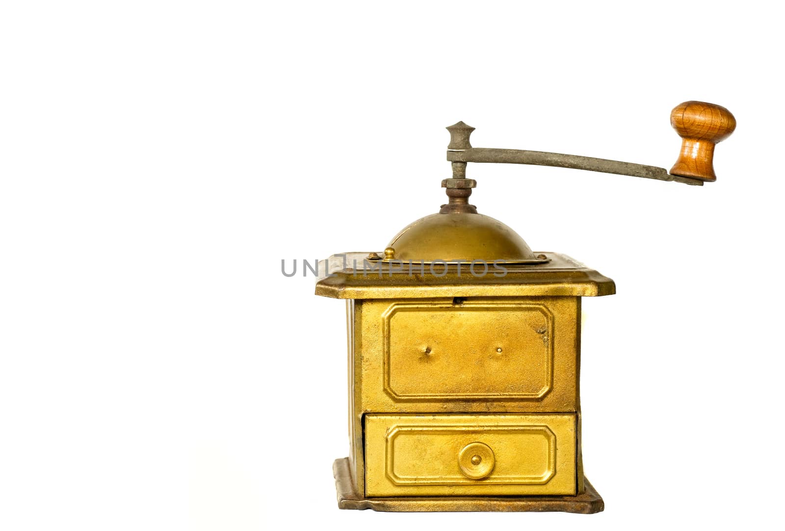 a vintage coffee grinder made of bronze color metal, isolated on white background