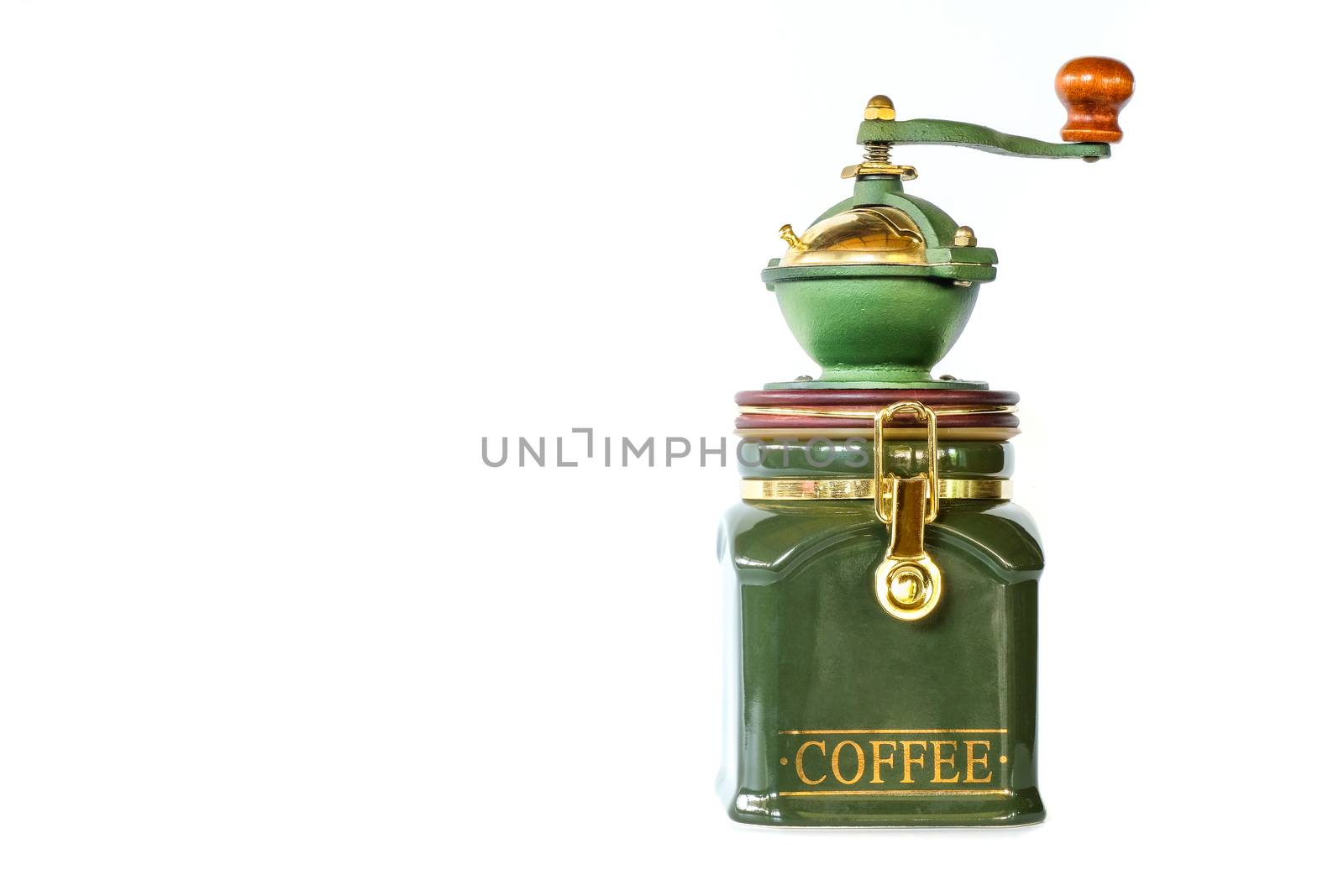 a vintage coffee grinder with green ceramic container and green metal bowel