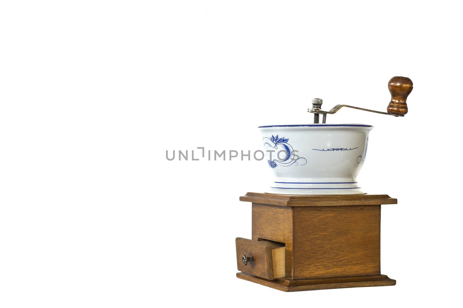 a vintage coffee grinder with white ceramic container, isolated on white background