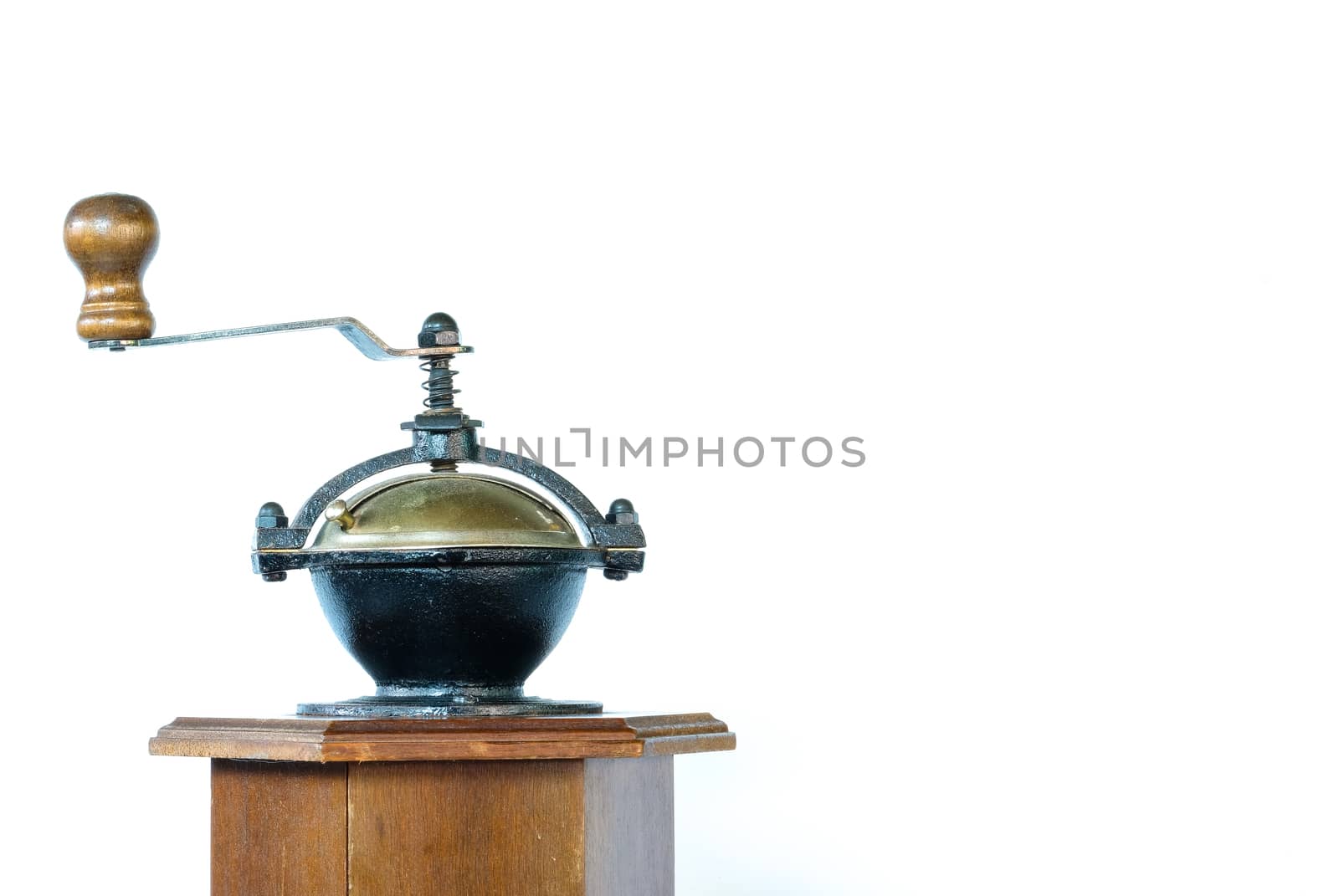 a vintage coffee grinder with intricate metal part, isolaed on white background