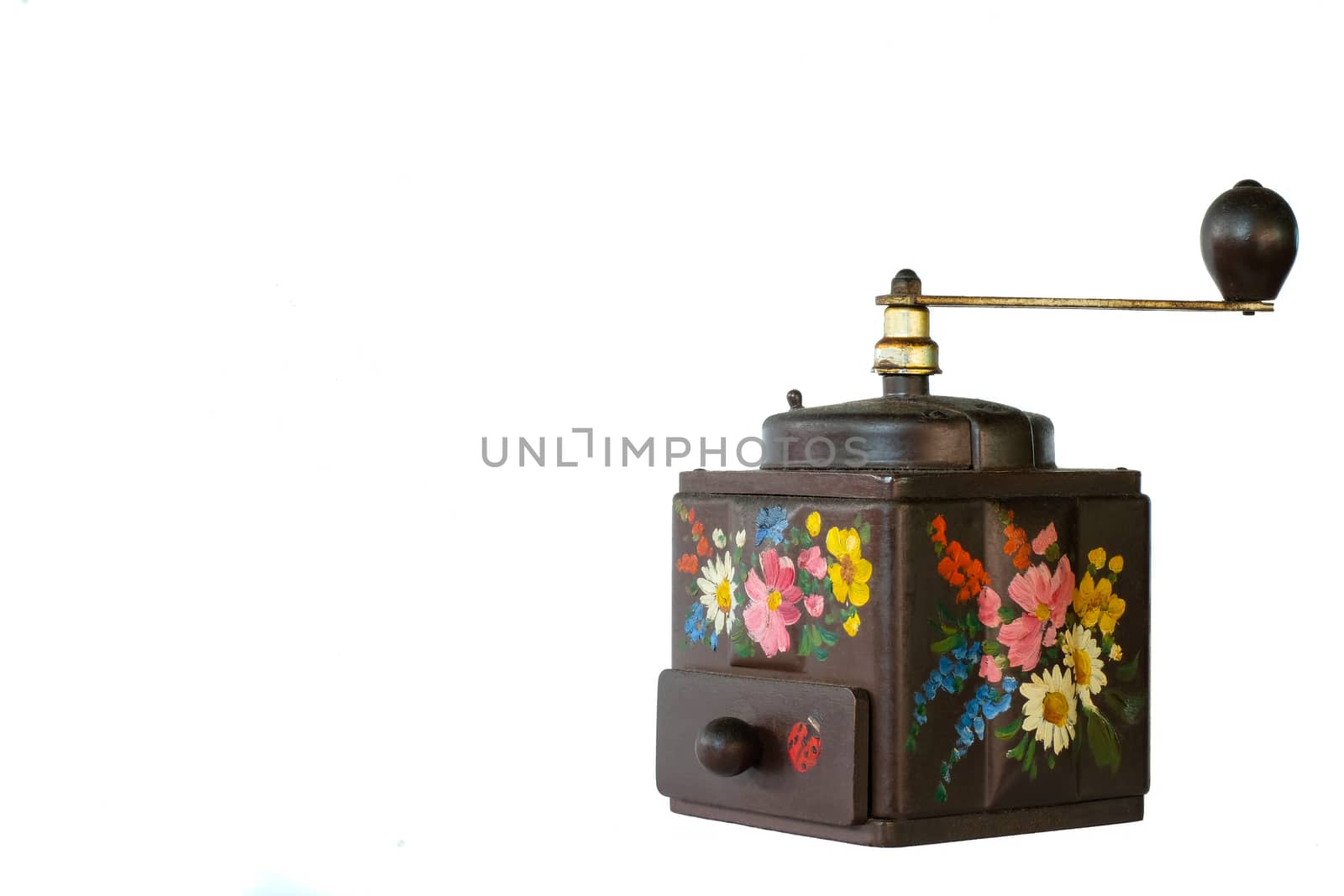 a vintage coffee grinder with floral pattern, isolated on white background