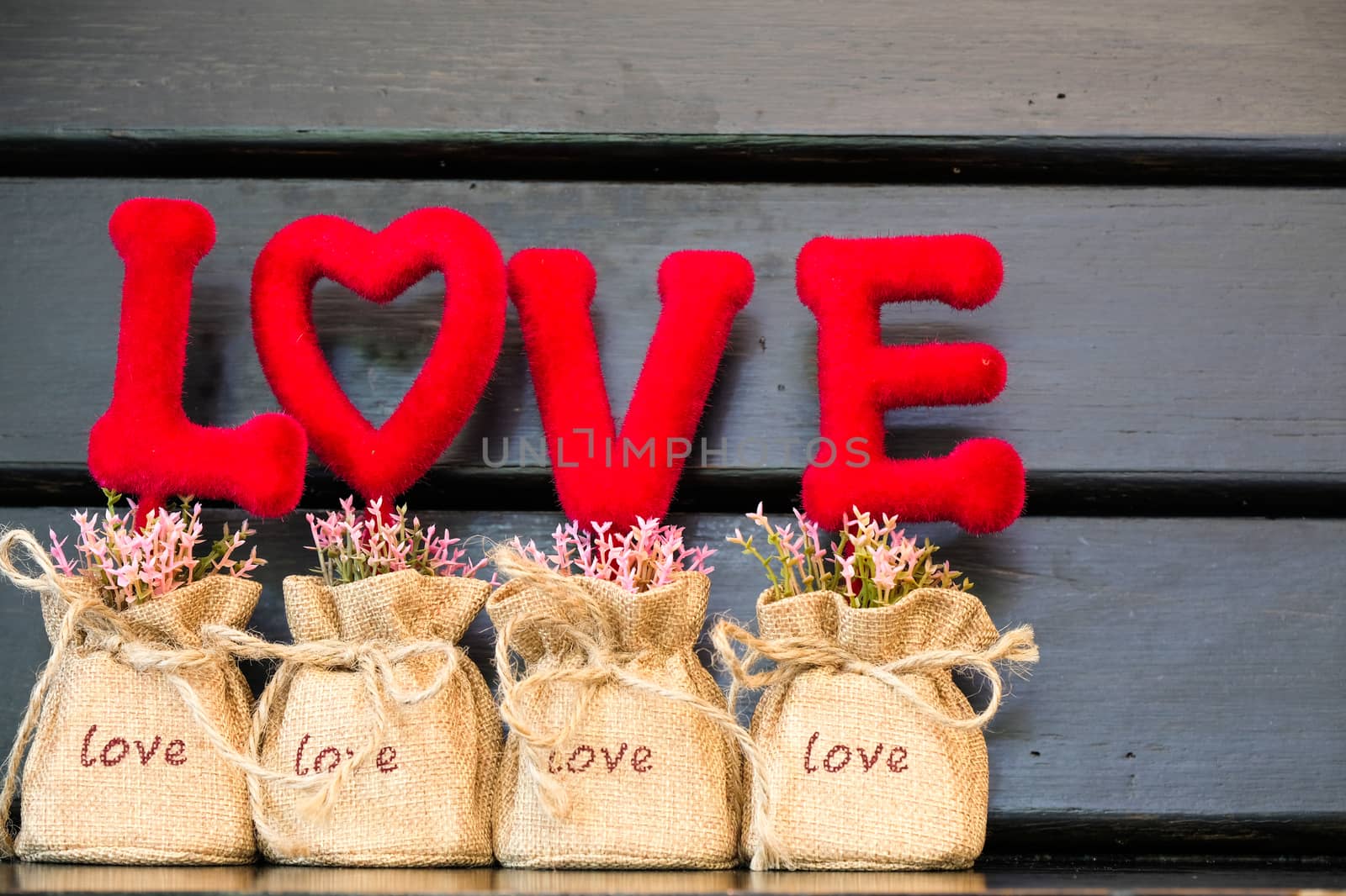 red love letters background with flowers and wood background