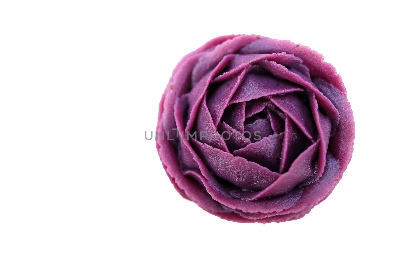 Purple Japansese sweet potato, cooked and arranged into rose pattern, a gourmet dessert, isolated on white background