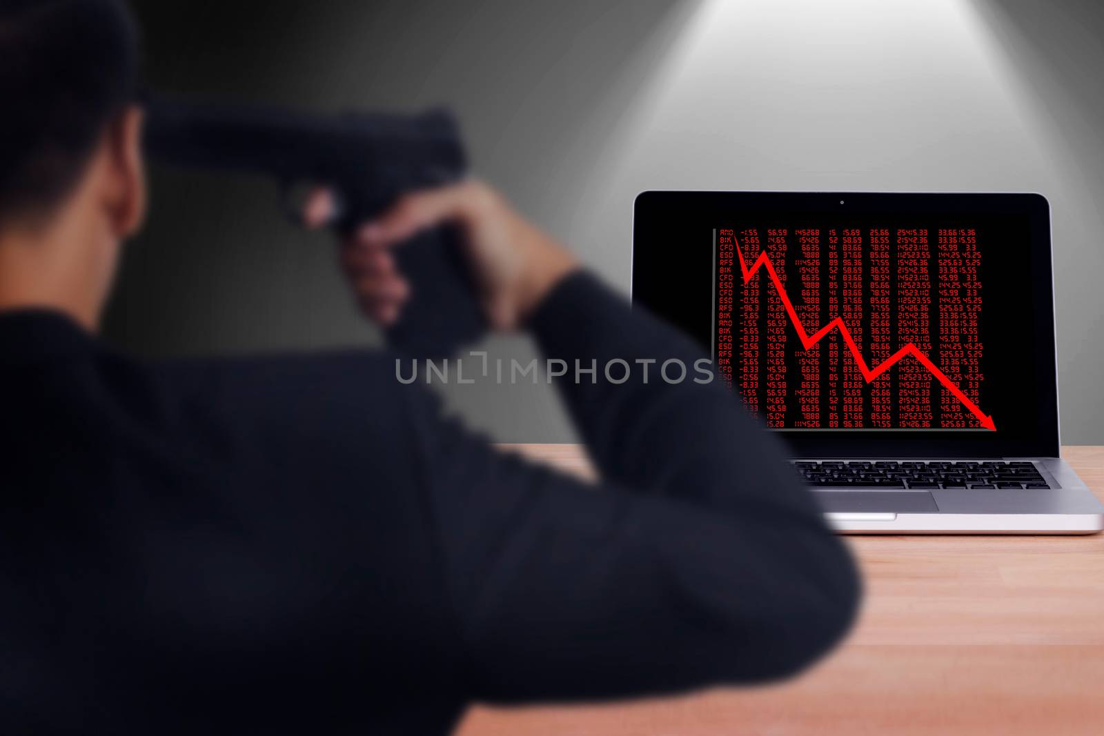 businessman hold handgun point to his head for suicide attempt after lose money from stock trade. stocks fall on economic downturn, causing people to play stress concept by asiandelight
