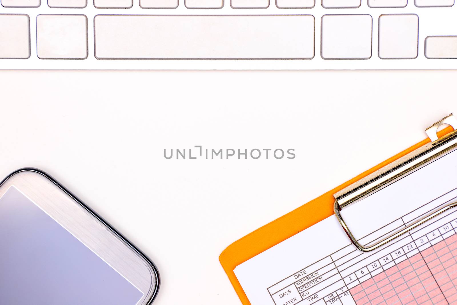 a computer keyboard, a patient vital sign chart, and a smartphone on a white table background, doctor working space concept