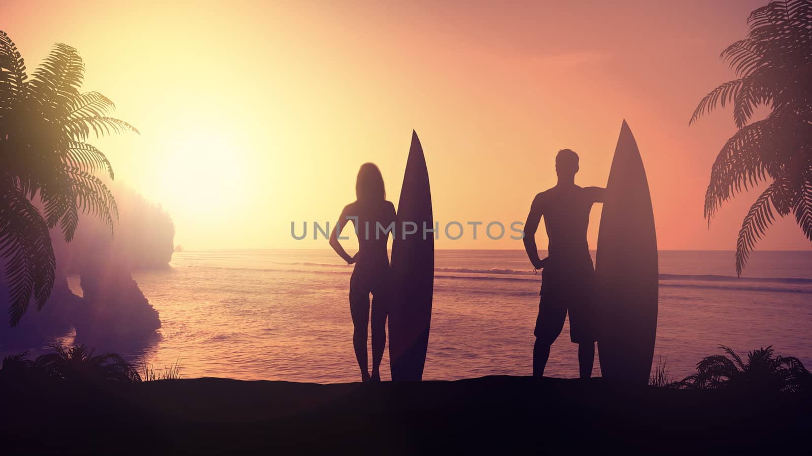 Couple of surfers lit by the setting sun against the backdrop of evening ocean.