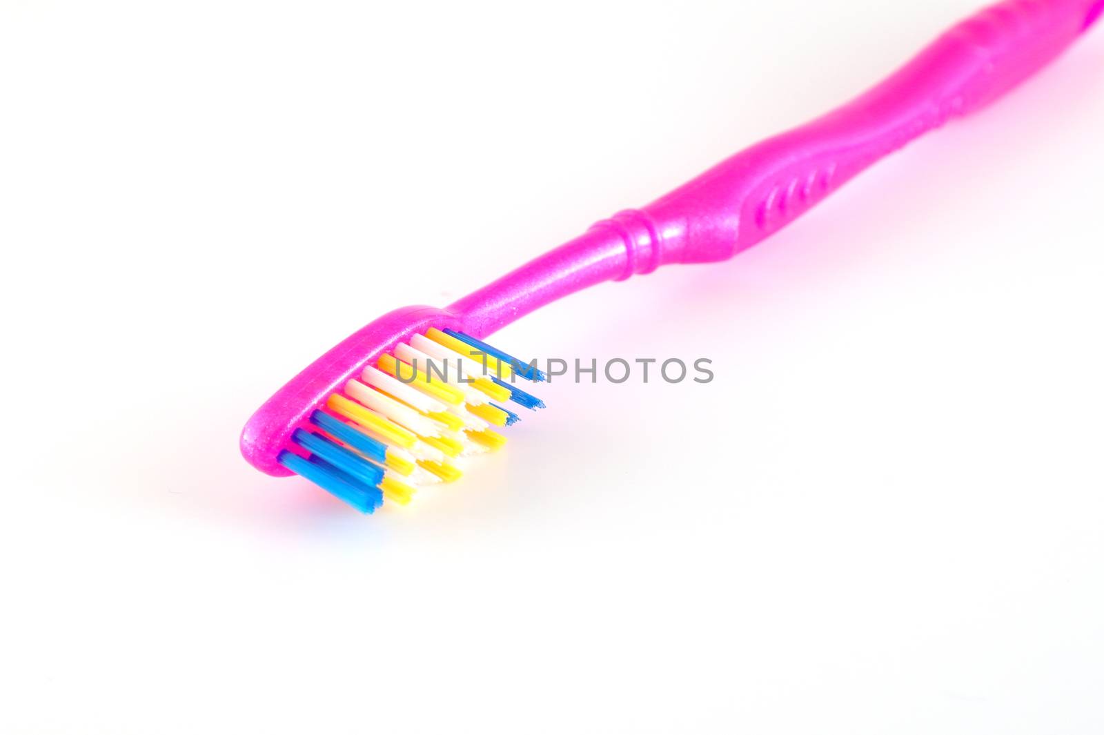 Tooth-brush over white. Shallow DOF.