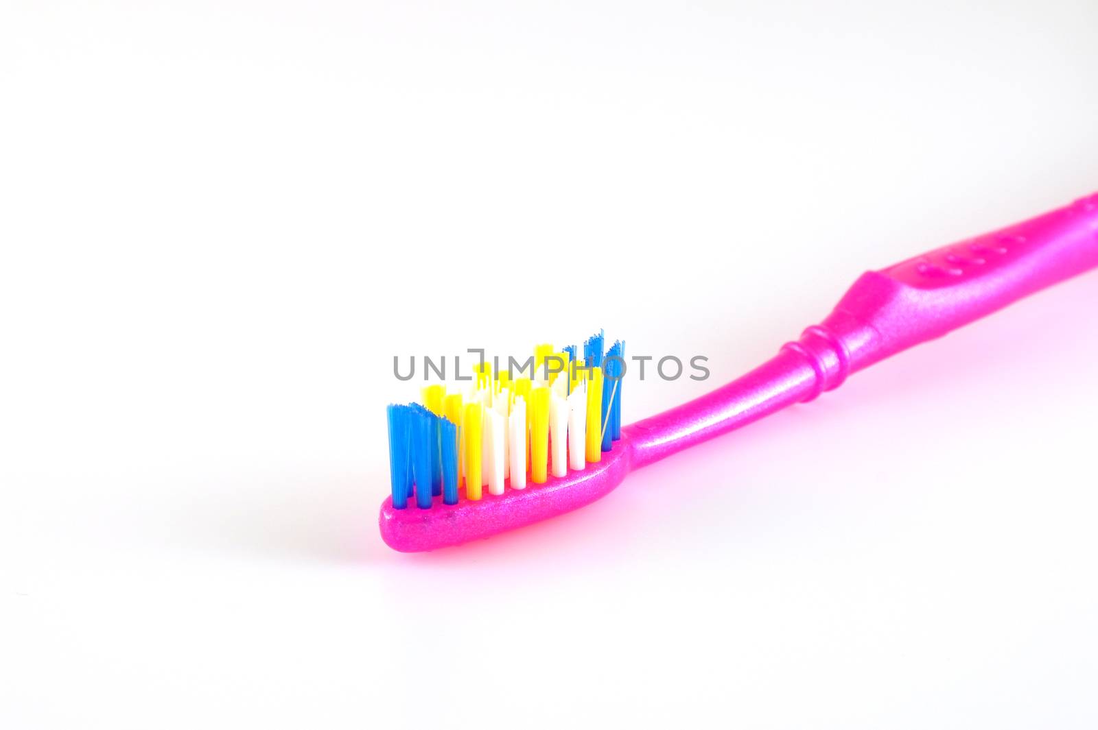 Tooth-brush over white. Shallow DOF.