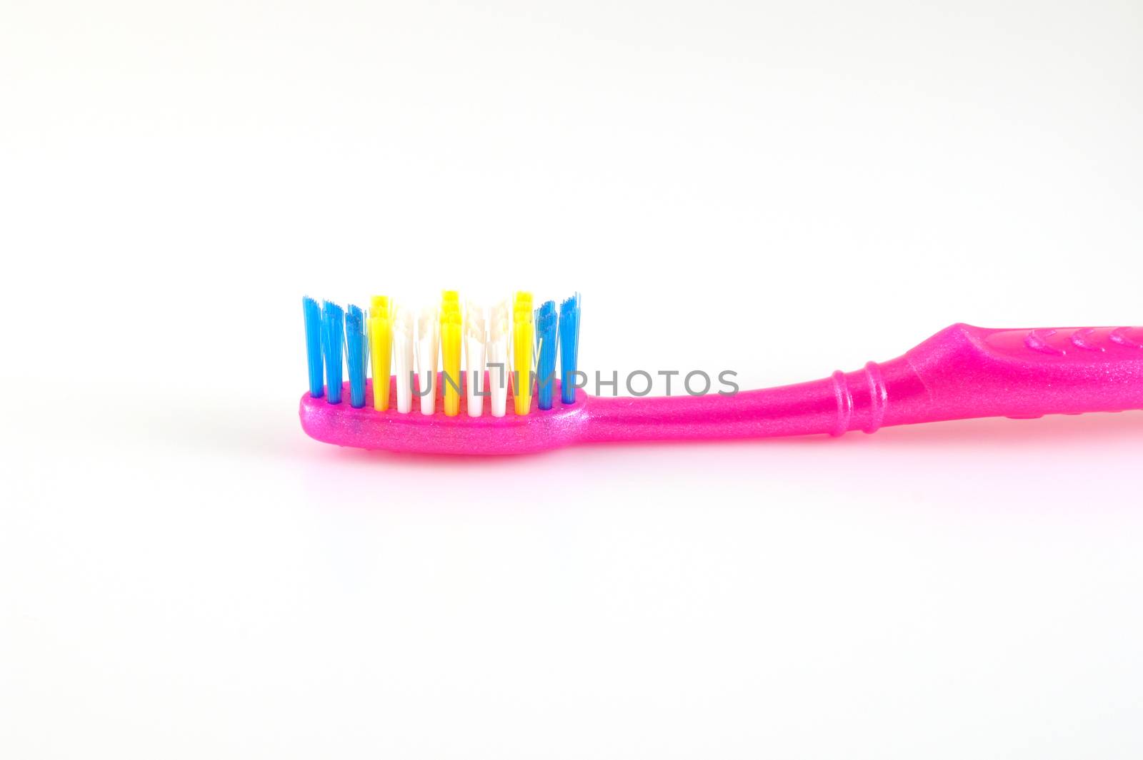 Tooth-brush over white. Shallow DOF.