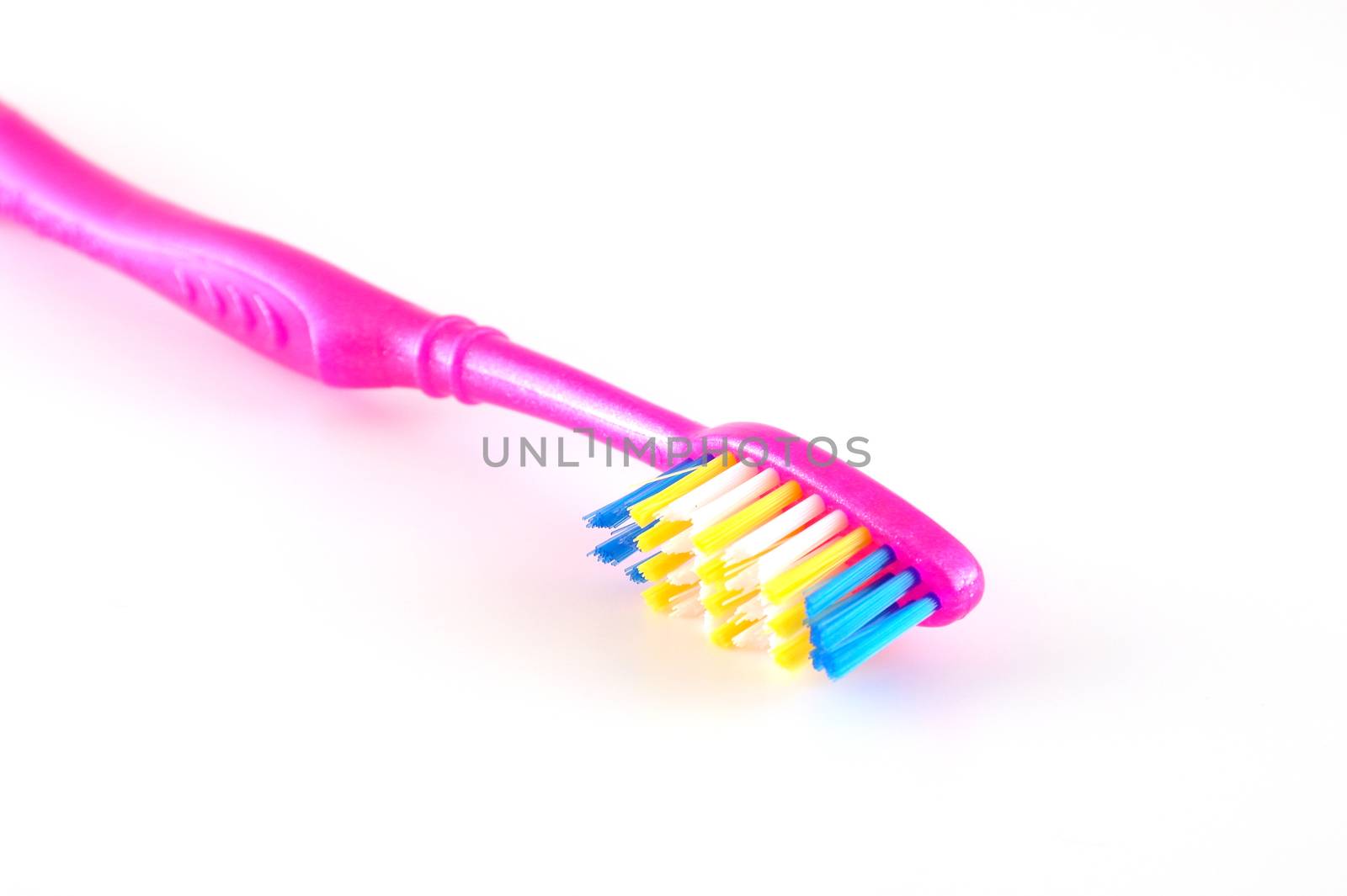 Tooth-brush over white. Shallow DOF.