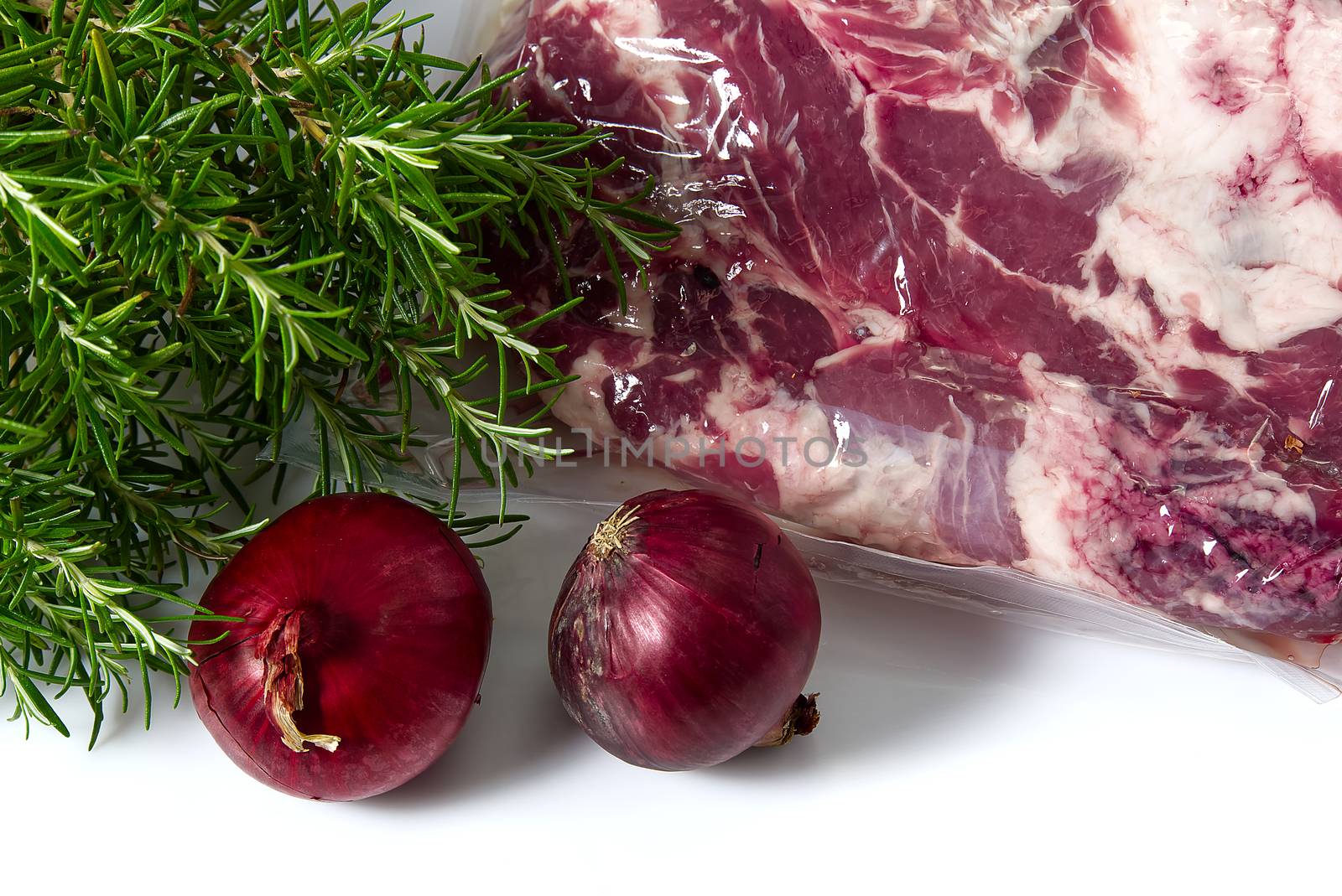 Raw Pork Meat with Red Onion and Rosemary on white background