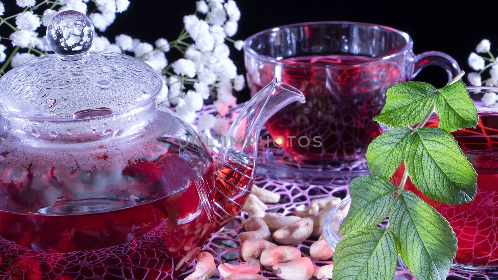 Creative layout made of cup of red tea and leafs. Tea time: cup of tea, carcade, karkade, rooibos. Oriental, cozy, ceremony,tradition,japanese, leafy,hygge,autumn,tea with raspberries,afternoon tea