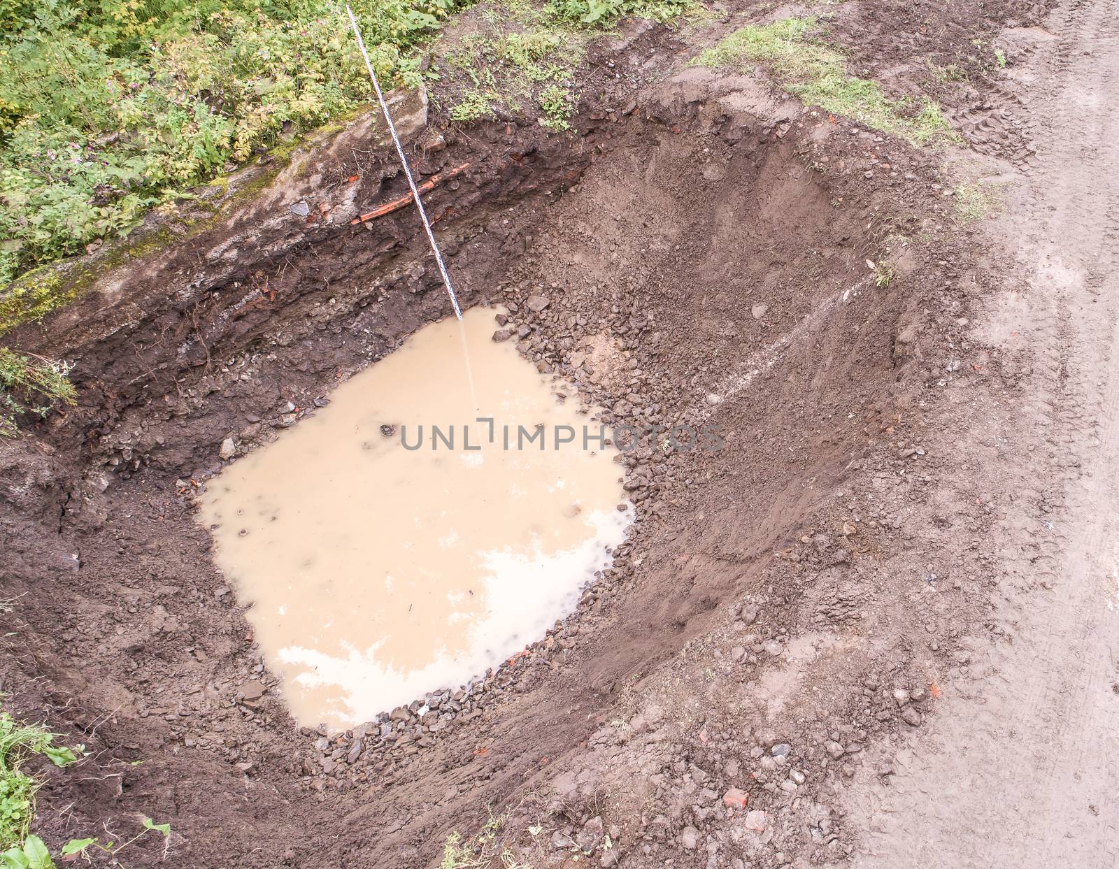 Building pit with groundwater ingress and measuring rod, Andreasberg, Harz mountains, aerial view