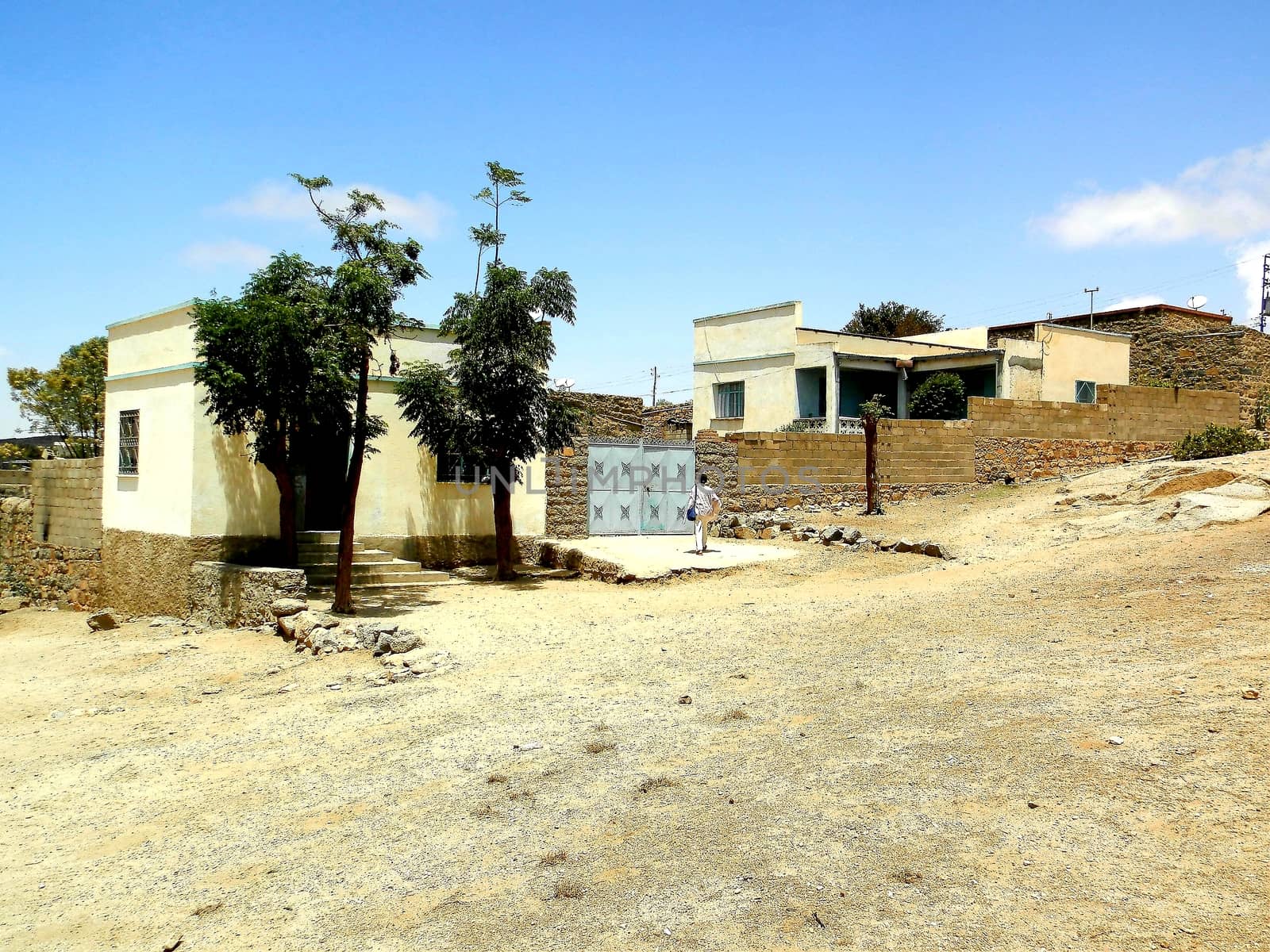 Eritrea, Africa - 08/10/2019: Travelling around the vilages near Asmara and Massawa. An amazing caption of the trees, mountains and some old typical houses with very hot climate in Eritrea.