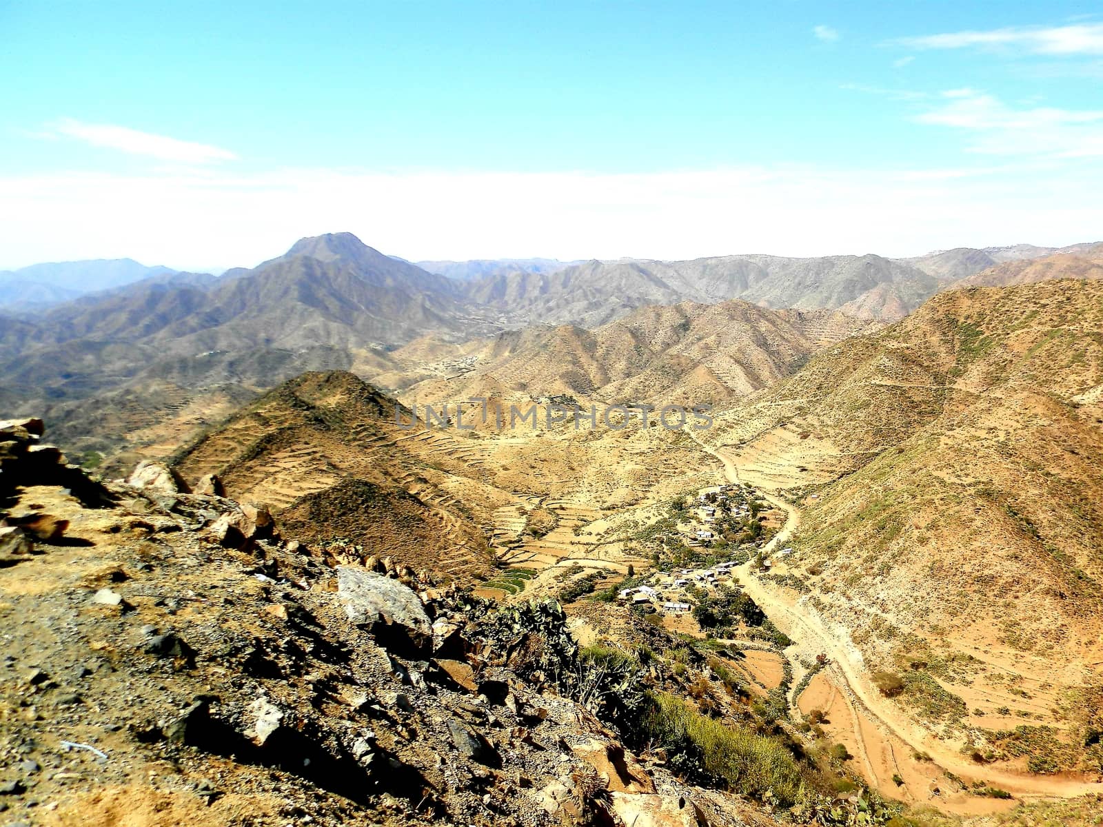 Eritrea, Africa - 08/10/2019: Travelling around the vilages near Asmara and Massawa. An amazing caption of the trees, mountains and some old typical houses with very hot climate in Eritrea.