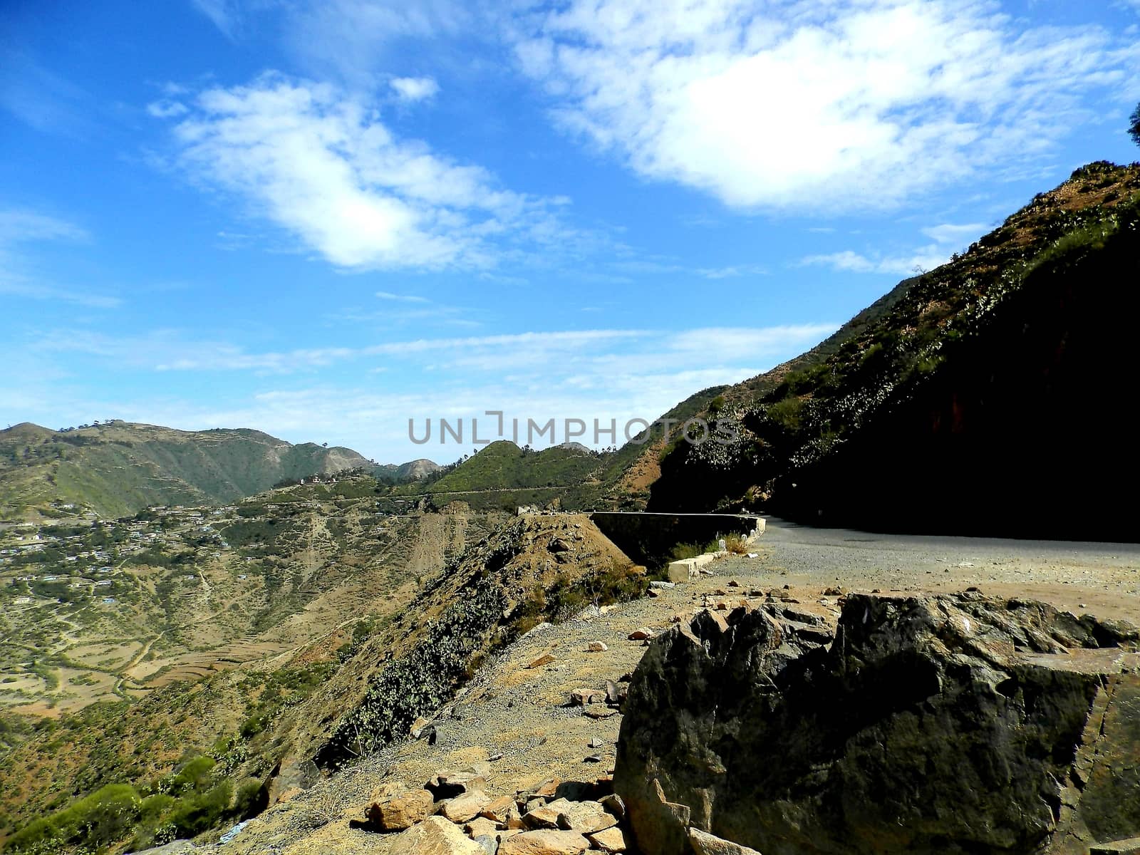 Eritrea, Africa - 08/10/2019: Travelling around the vilages near Asmara and Massawa. An amazing caption of the trees, mountains and some old typical houses with very hot climate in Eritrea.