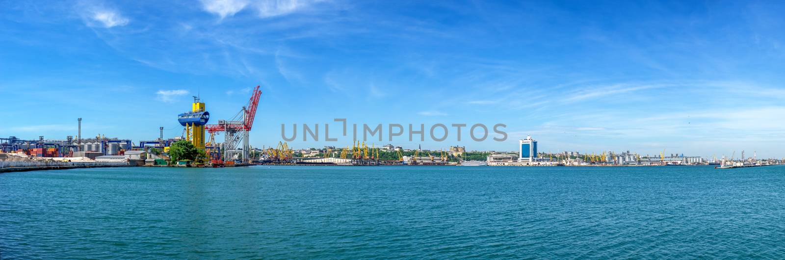 Lighthouse at the entrance to the harbor of Odessa seaport, on a sunny summer day