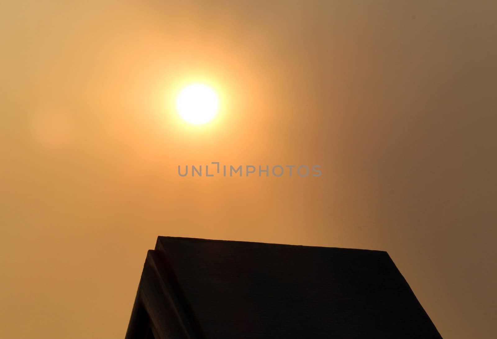 View of sunset in evening with silhouette of building. nature background. by TEERASAK