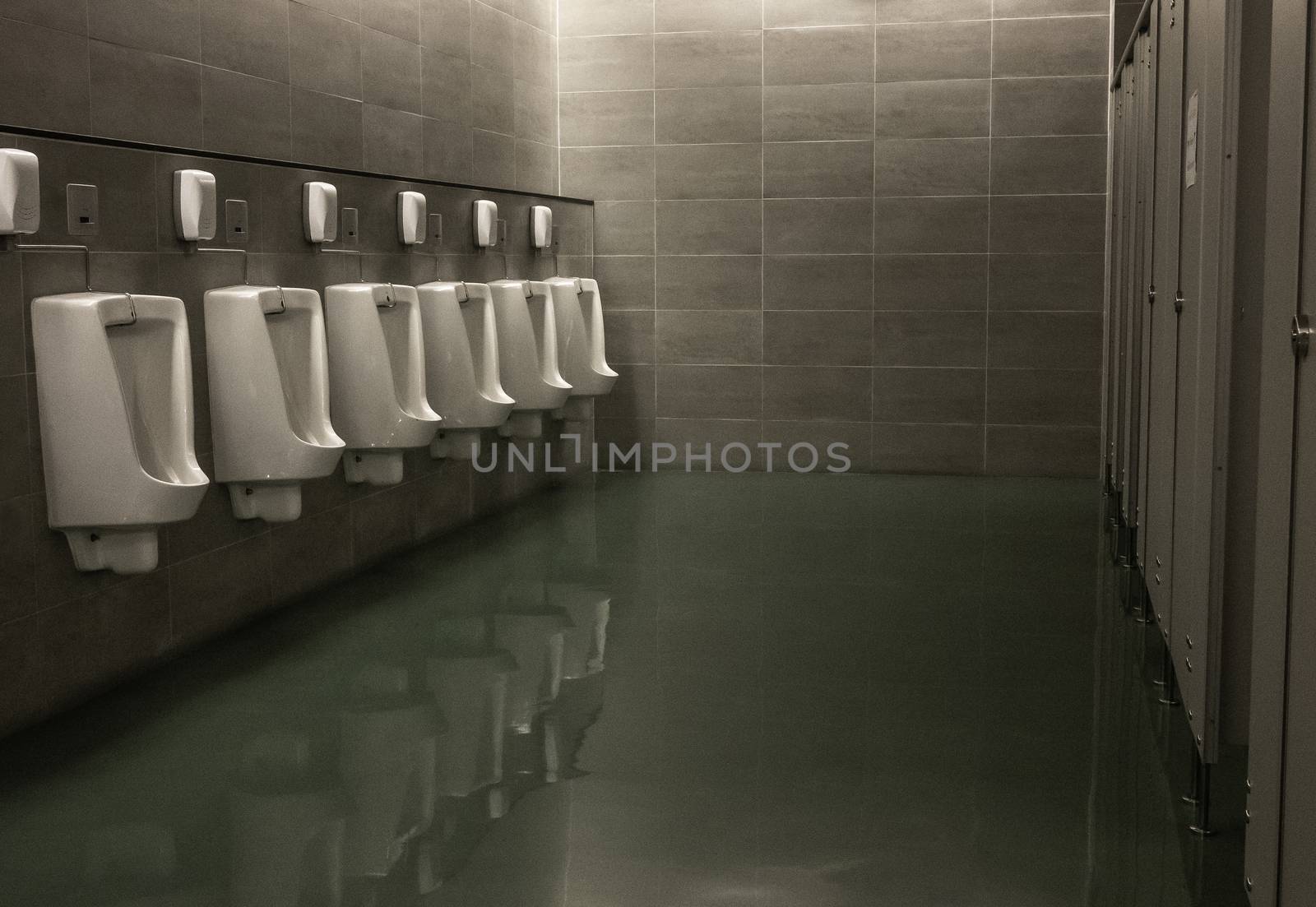 Close-up of row modern ceramic Male urinal. Toilets in the mall at Chiang mai city. by TEERASAK