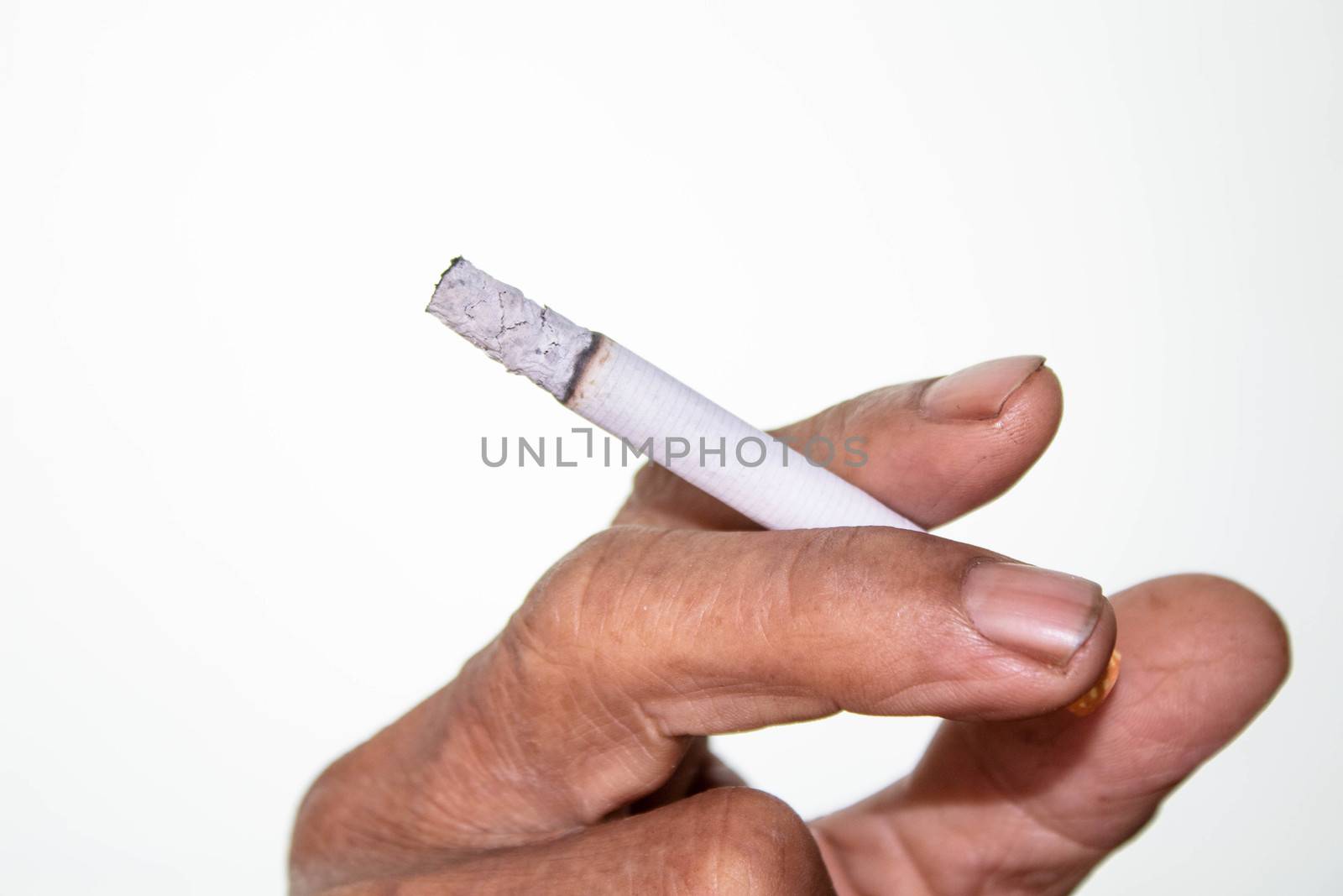 World No Tobacco Day; Asian man holding cigarette with smoke isolated on white background with space for text.